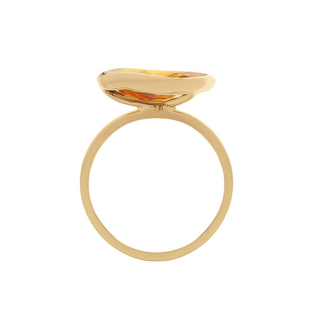 9ct yellow gold and citrine ring
Hallmarked
Edition of 5
UK Size N/O

With a love for all things sugary, it was perhaps inevitable that Tessa would look to sweets as the basis for a jewellery collection. Set with a large pookie-cut citrine, the