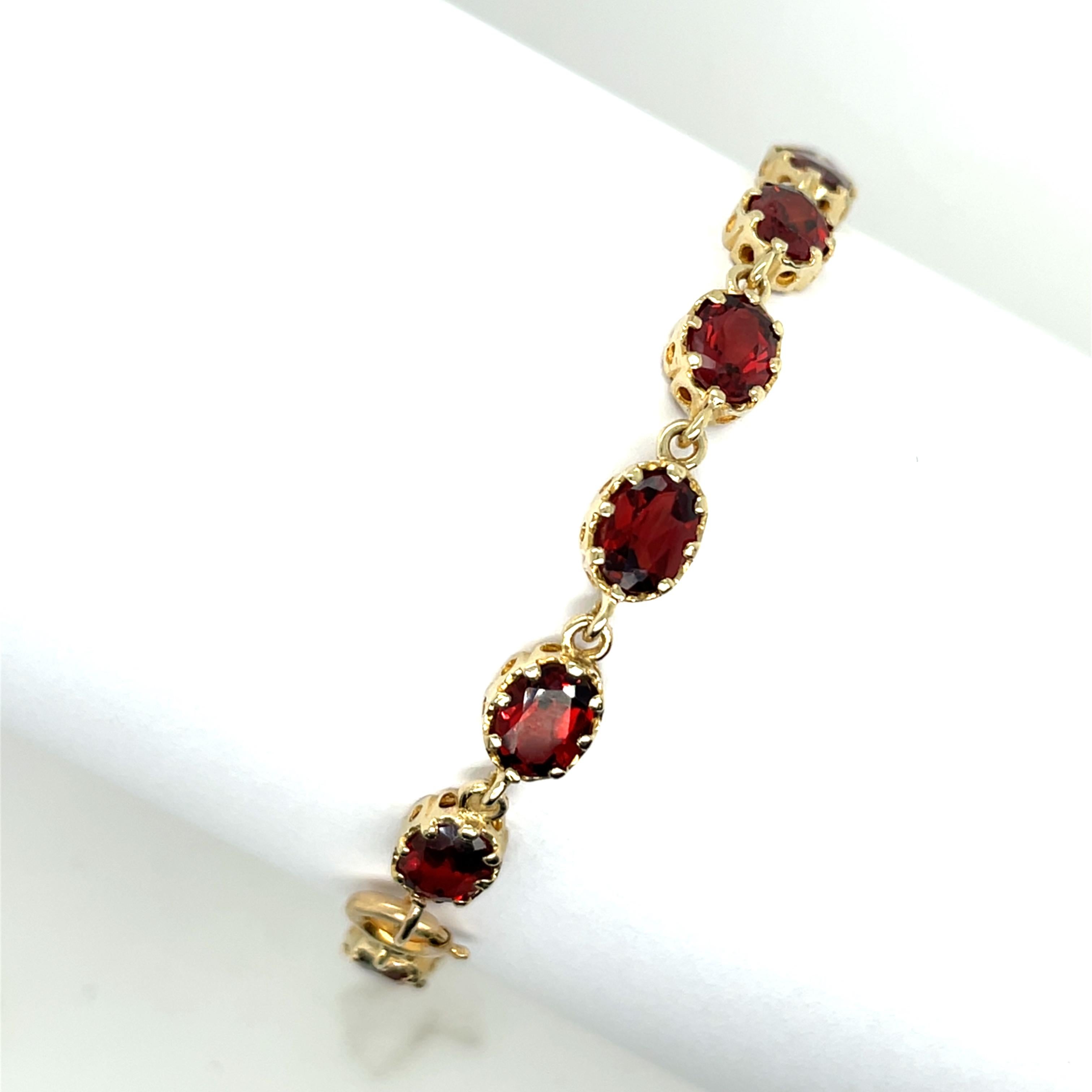 Oval Cut 9ct Yellow Gold Bracelet Set With 16 oval Natural Garnets