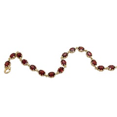 9ct Yellow Gold Bracelet Set With 16 oval Natural Garnets