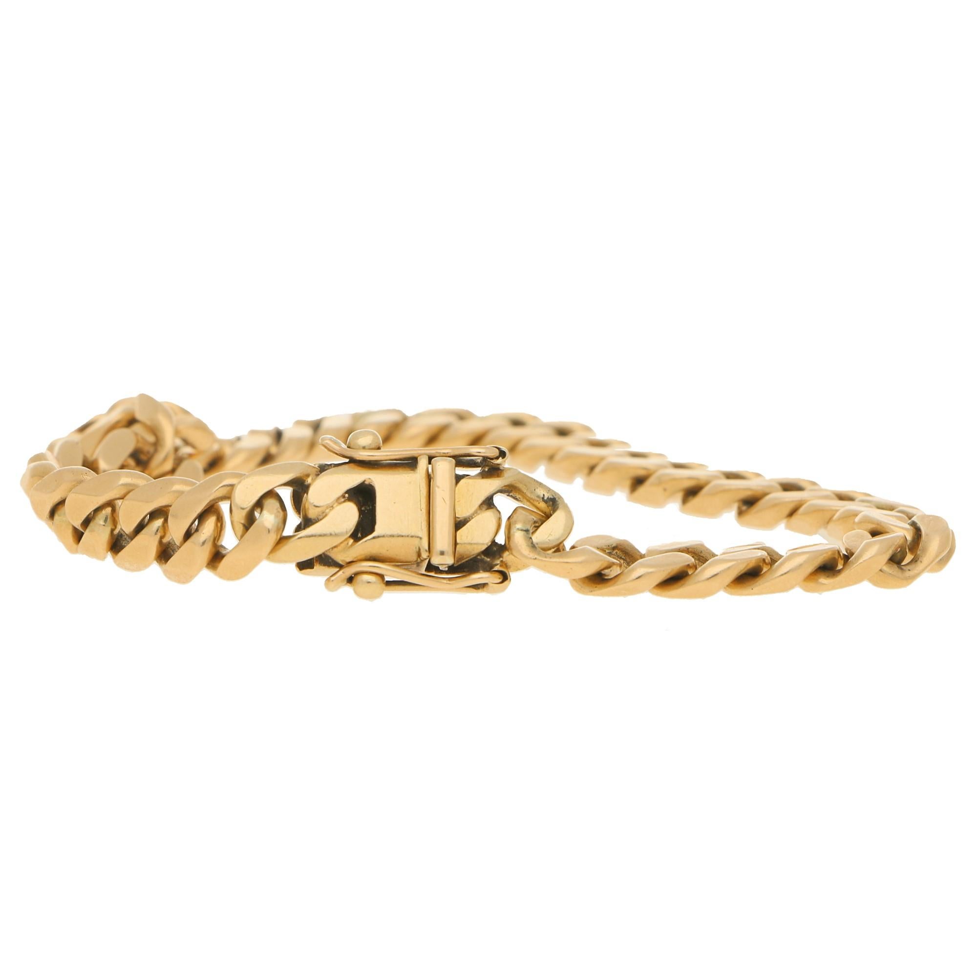 A vintage cuban-link chain bracelet in 9 carat yellow gold, doubly secured with a click-shut clasp and a safety catch fitting. 
Hallmarked in Birmingham, date letter T for 1993.
Dimensions: 20.5cm in length, 0.8cm width. Gross weight: 28.10g.
Miami