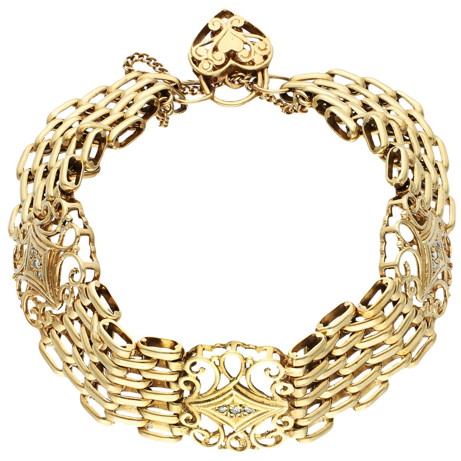 Embrace timeless elegance with this Pre-Owned 9ct Yellow Gold & Diamond Fancy Bracelet. Exquisitely crafted, this bracelet features the classic gate design, enhanced by three intricate scrollwork panels, each meticulously set with glittering