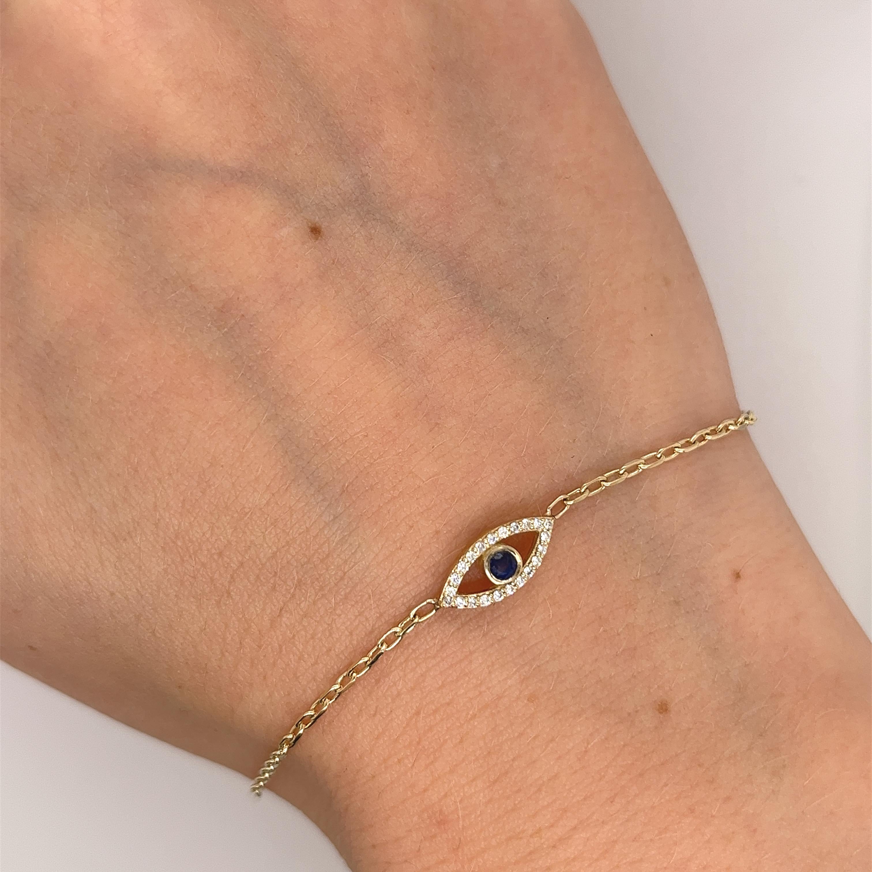 
Made by Jewellery Cave- our exquisite 0.08ct diamond set and round sapphire evil eye bracelet—
an enchanting fusion of style and symbolism. 
Crafted in 9ct yellow gold, the centrepiece of this mesmerizing bracelet is the striking Evil Eye charm,