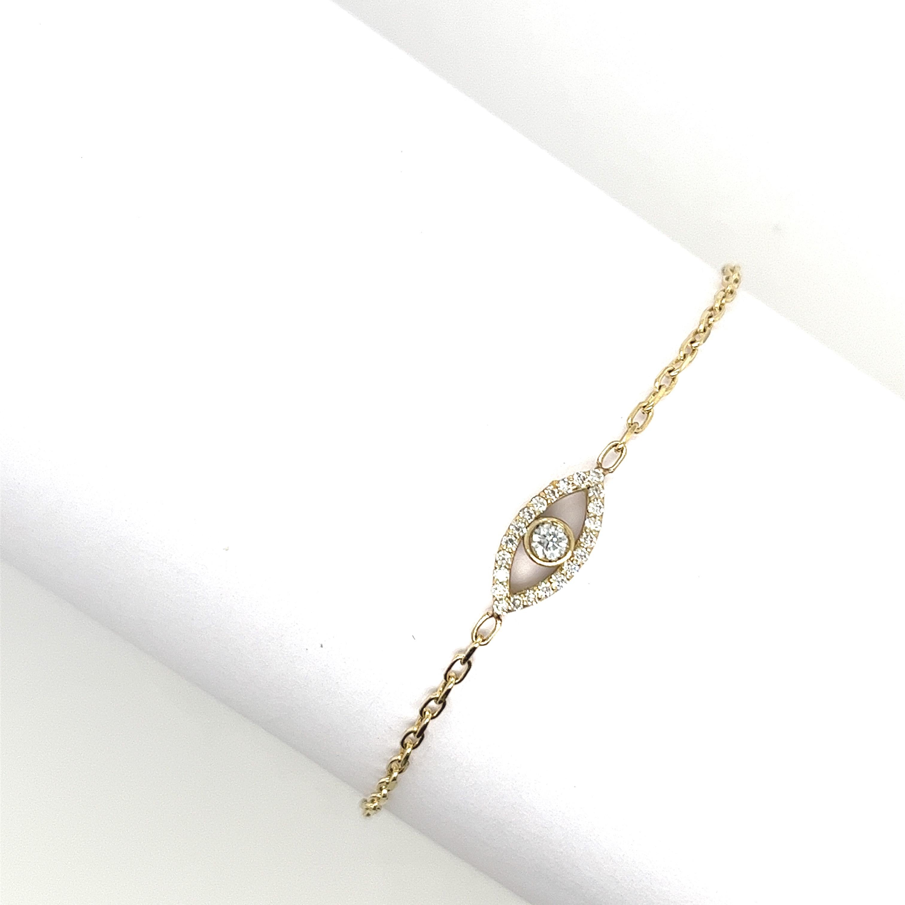 Made by Jewellery Cave- our exquisite 0.18ct diamond set evil eye bracelet—an enchanting fusion of style and symbolism. Crafted in 9ct yellow gold, the centrepiece of this mesmerizing bracelet is the striking Evil Eye charm, symbolizing protection
