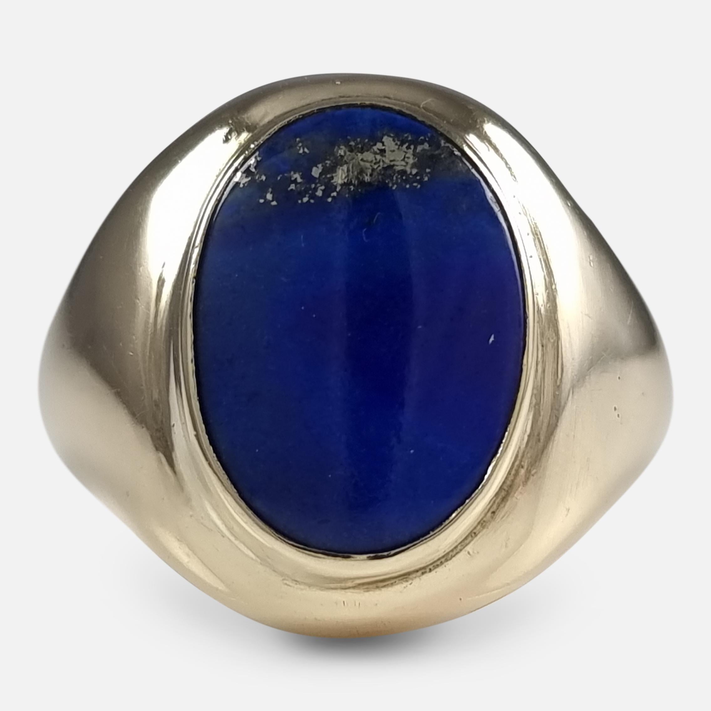 A George VI 9ct yellow gold Lapis Lazuli cocktail ring. The chunky gold ring is of hollow construction, with a oval Lapis Lazuli within a rub-over setting.

The ring is hallmarked with London marks, date letter 'F' to denote 1941, and stamped