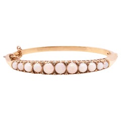 Armreif aus 9 kt Gelbgold mit Opal und Diamant