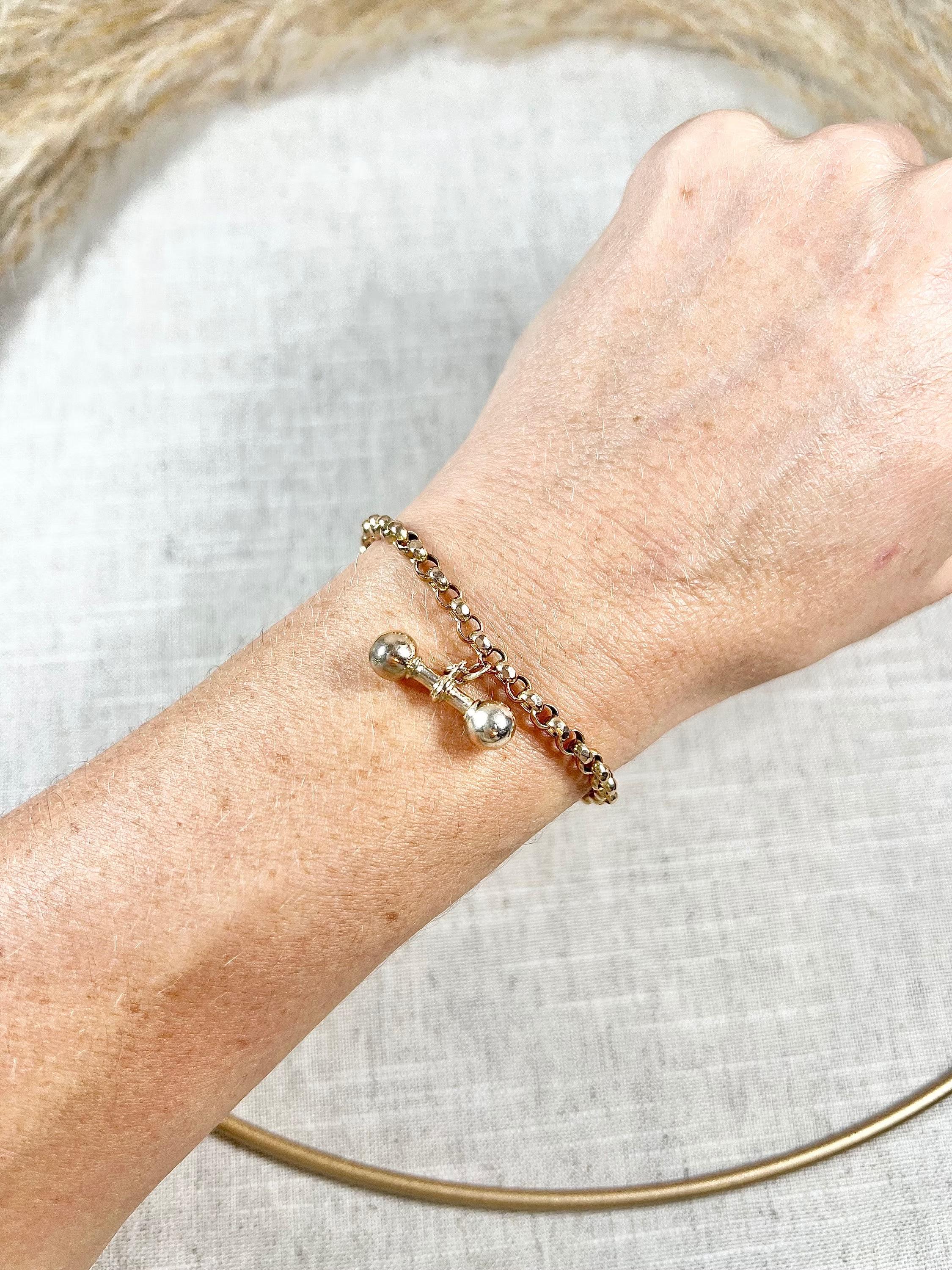 Antique Rose Gold Bracelet 

9ct Gold Stamped 

Circa 1900

This 9ct pale yellow gold bracelet features a beautifully faceted belcher link design that adds a touch of elegance to any outfit. The bracelet is secured with a swivel clasp and features a