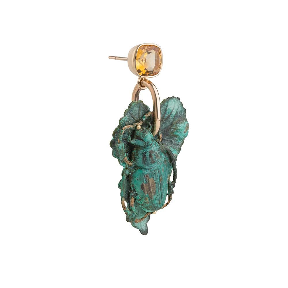 9ct yellow gold, verdigris brass and citrine earrings
Edition of 2
Hallmarked

In Tessa’s imagined garden there is a great dry-stone wall encircling the boundary. The wall is covered by dense ivy, so thick in places that it takes on the appearance