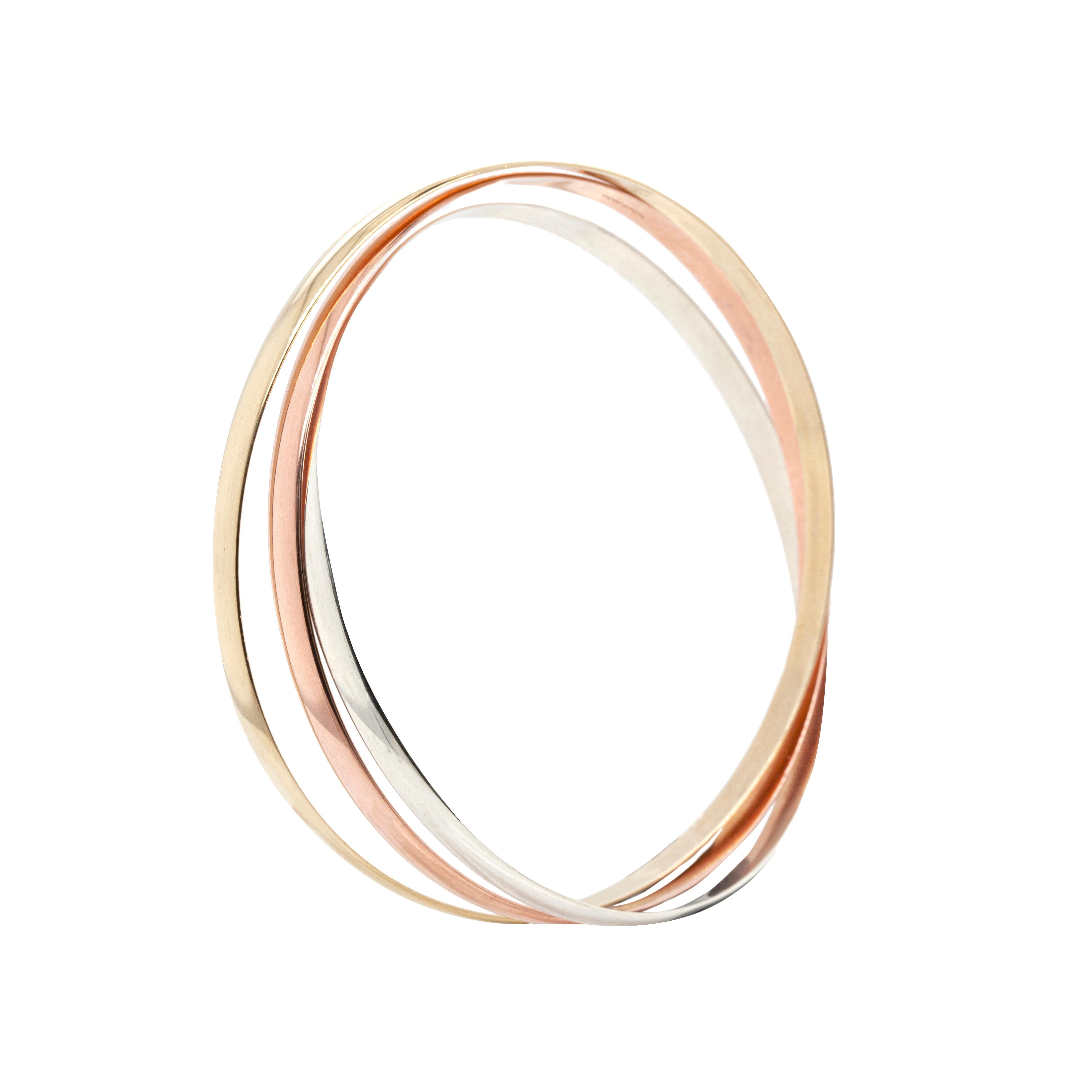 This gorgeous three-tone Russian Wedding Bangle is the perfect piece that goes with absolutely everything. Combining beautiful rose, yellow and white nine carat gold, it is an elegant and timeless design.

Three bangles, each with a height of 4mm,