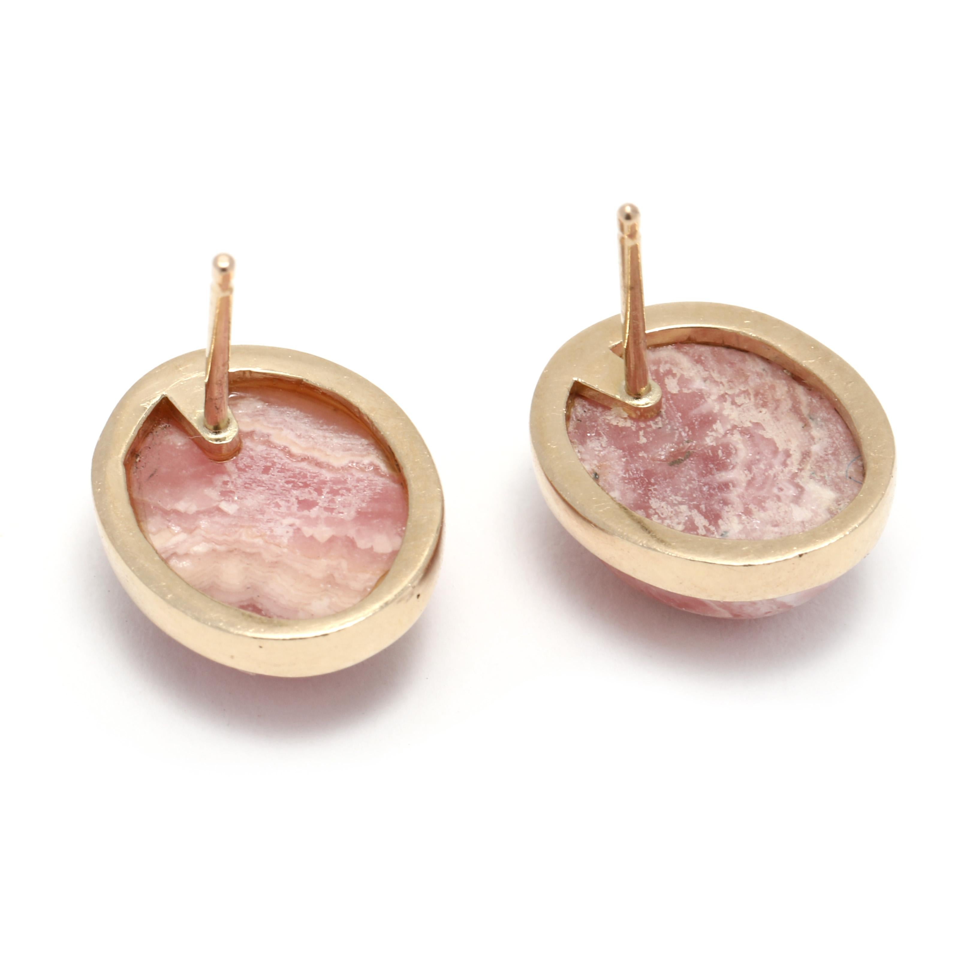 These beautiful 9ctw Rhodochrosite stud earrings are the perfect way to add a touch of glamour to any outfit. Crafted from 14K yellow gold, the earrings feature two pink rhodochrosite stones, each measuring 0.5 inches in length. These stunning studs