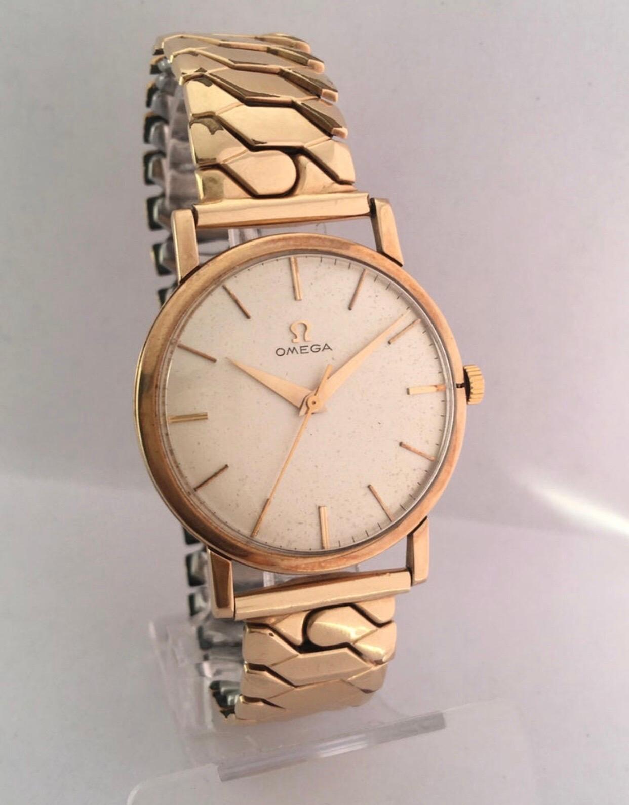This beautiful vintage London 1961, 33mm watch diameter hand winding gold watch is in good working condition and it is running well (keeps a good time) 
Visible signs of ageing and used with light marks on the dial, small split on the bezel as