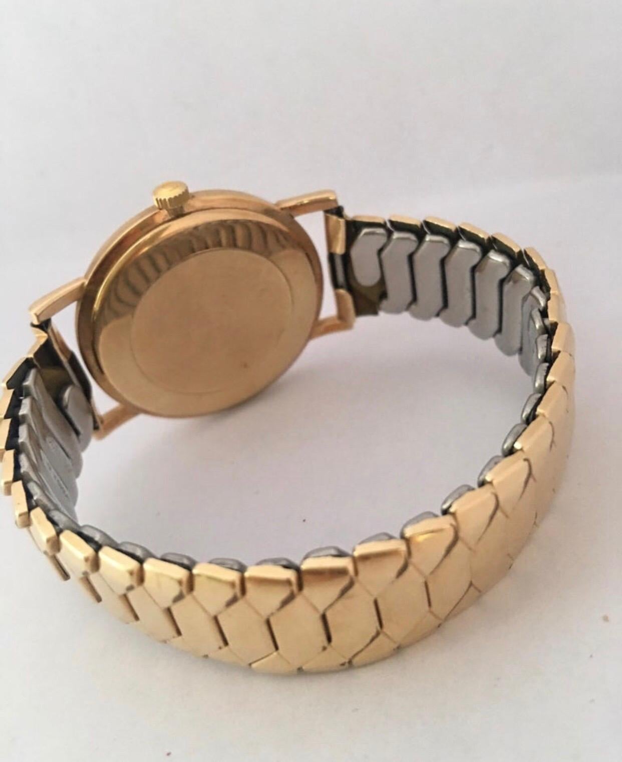 9 Karat Gold und gerolltes Goldarmband Omega Mechanische Uhr 1960er Jahre im Angebot 3