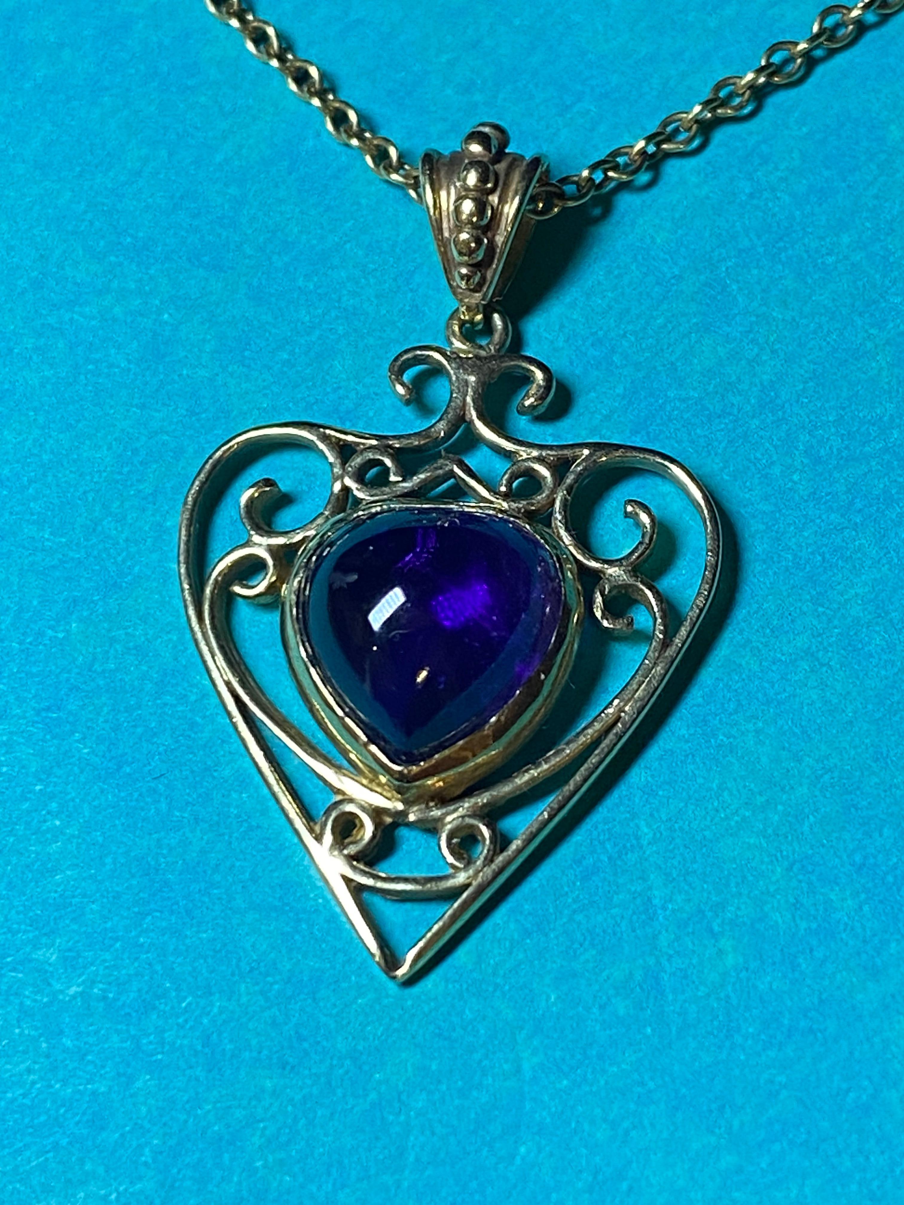 Amethyst Heart-Shaped (Spade) Renaissance Style Pendant 
is a striking piece of Italian Retro jewelry 

~~~~~~

Featuring a heart-shaped cabochon Natural Amethyst, 
bezel set within an intricate filigree setting 

Of estimated weight over 4.00ct,