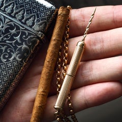 9K Gold Cigar/Cigarette Pick Drill Pendant with Engine Turned Decorations Asprey