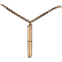 9K Gold Cigar/Cigarette Pick Drill Pendant with Engine Turned Decorations Asprey