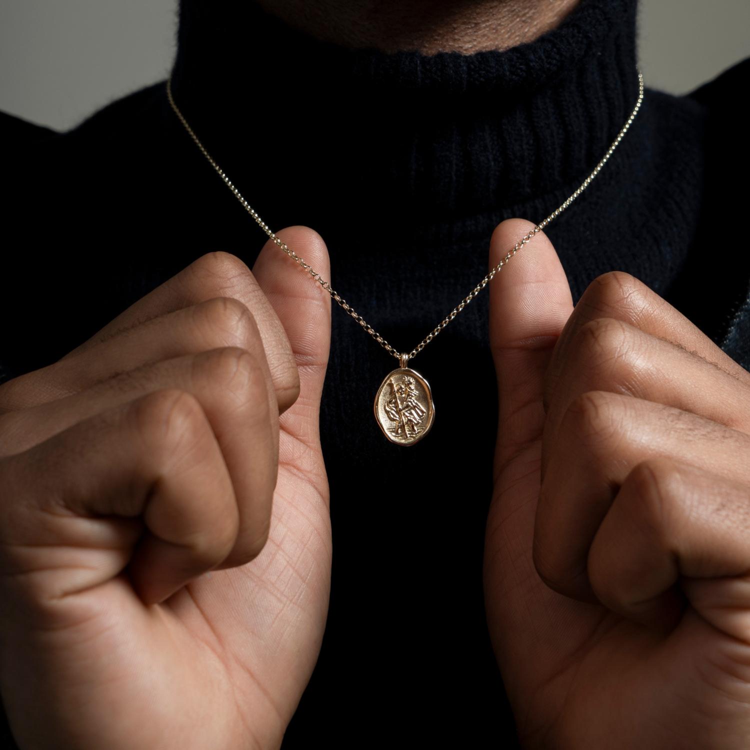Traditionally given to a loved one who will be travelling, a St. Christopher is seen as a protector to keep them safe on their journey. This 9k solid gold necklace has a St. Christopher suspended on belcher chain - the pendant is part of our