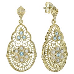 Pendiente colgante de filigrana estilo vintage de oro de 9 quilates con topacio azul natural y perla