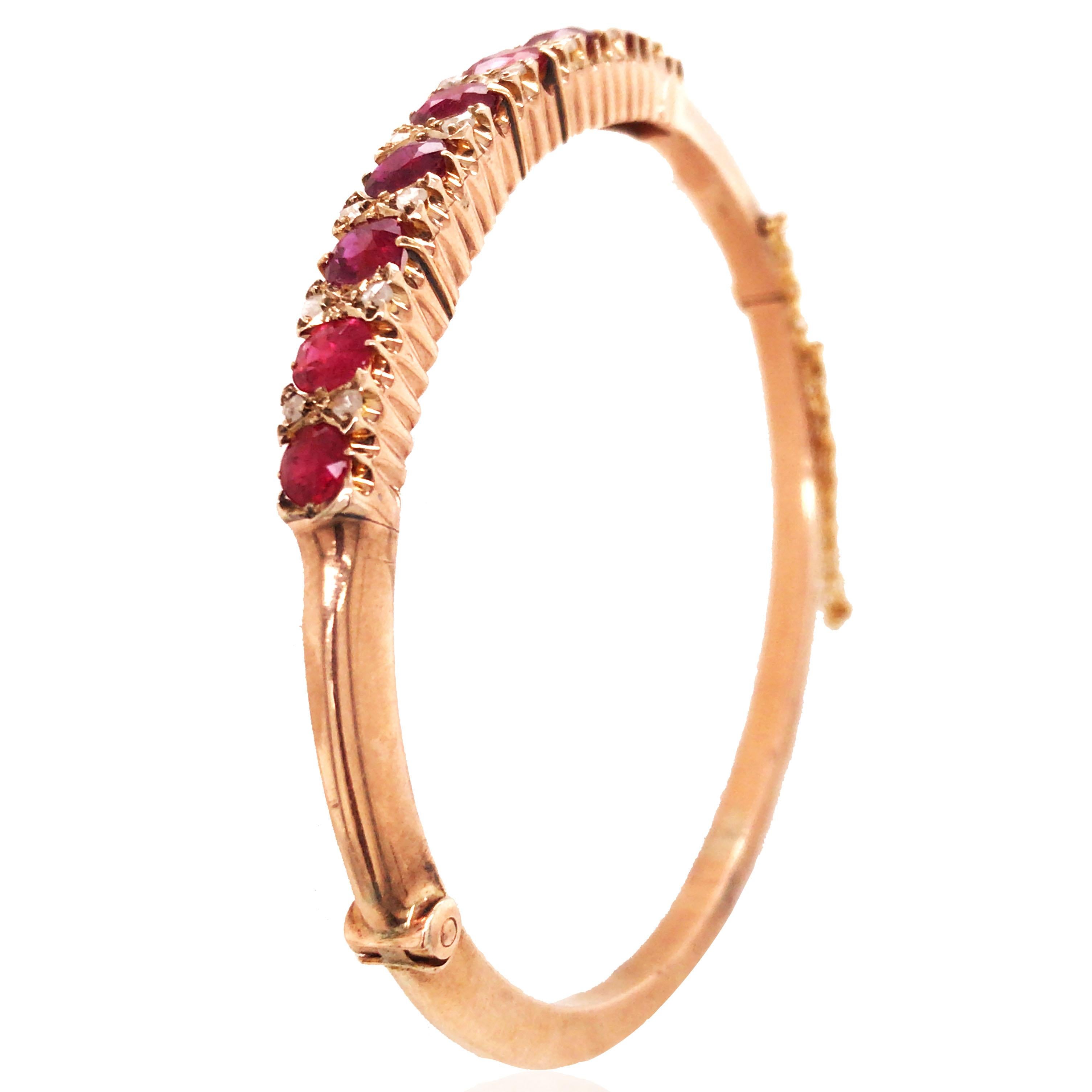 This ruby diamond gold bangle consists of 16 round-cut diamonds and 9 oval-cut rubies. Diamond approx. 0.08ct in total and ruby approx. 4.09ct in total.

Diamond: 0.08ct
Ruby: 4.09ct
Weight:  12.1grams
Measurement:  17cm in length