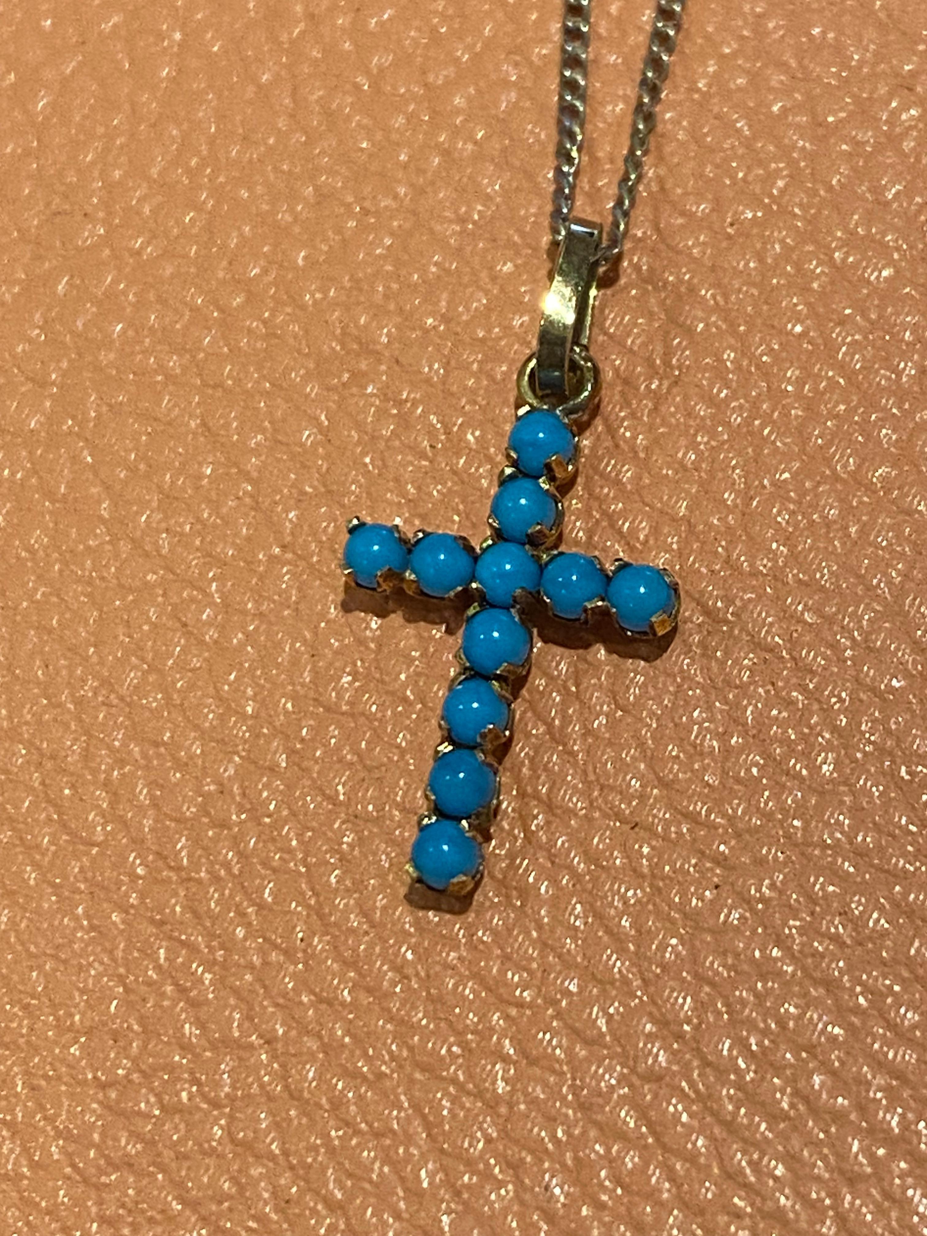 Add a vintage charm to your collection with this 9K yellow gold cross pendant,
set with 11 natural turquoises of gorgeous & distinctive sky blue colour

On a matching sterling silver chain,
completed by spring ring clasp 

Pendant is measuring 23mm