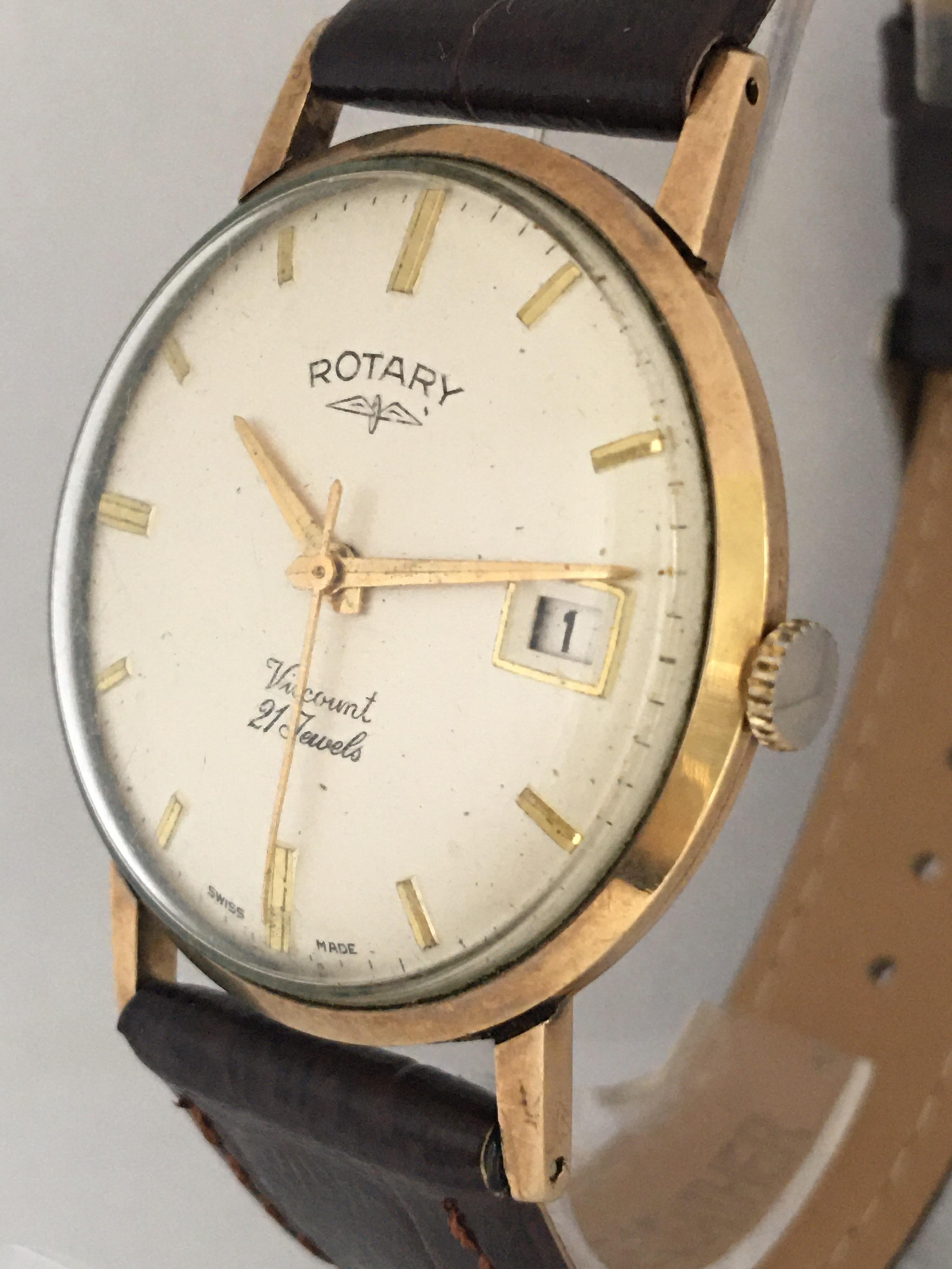 This beautiful vintage hand winding gold watch is in good working condition. It recently been serviced and it is running well. Visible signs of ageing and wear with light scratches on the gold watch case as shown. It’s been fitted with a new brown