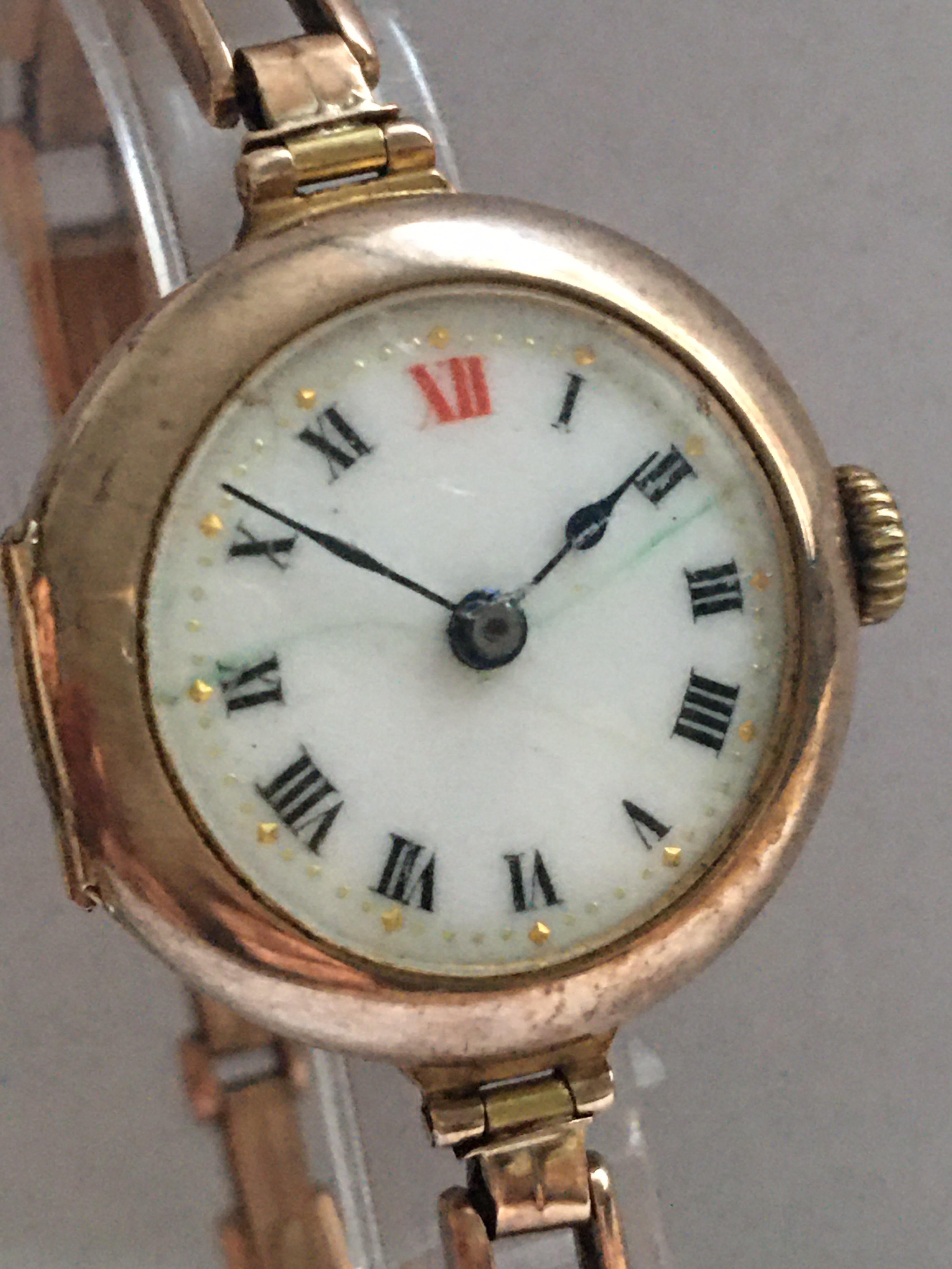 This beautiful gold antique trench watch is working and ticking well. with its stunning flexible rose gold band. Visible cracks on the enamel dial as shown. some dents on the back case cover and the henge snapped as shown.

Please study the images