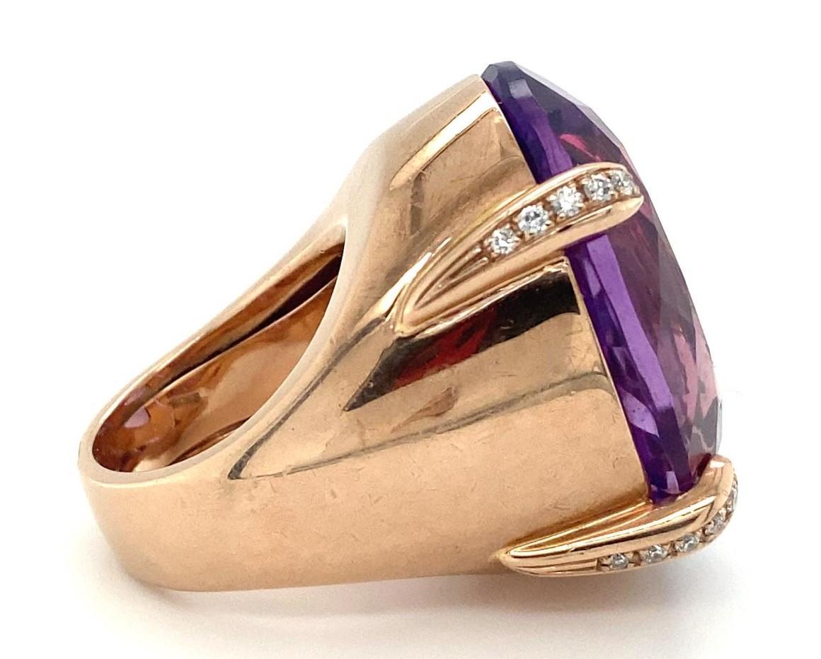 Gorgeous Heavy Cocktail Ring Set in 9k Rose Gold
Features Large Prong-Set Oval Shaped Amethyst
Appx Dimensions of 29 mm x 22.7 mm x 15.8 mm
Prongs Feature Small Diamond Accents (Appx 0.50 ctw)
Width of Band = 6 mm
Size 6.25
Total Mass = 36.8