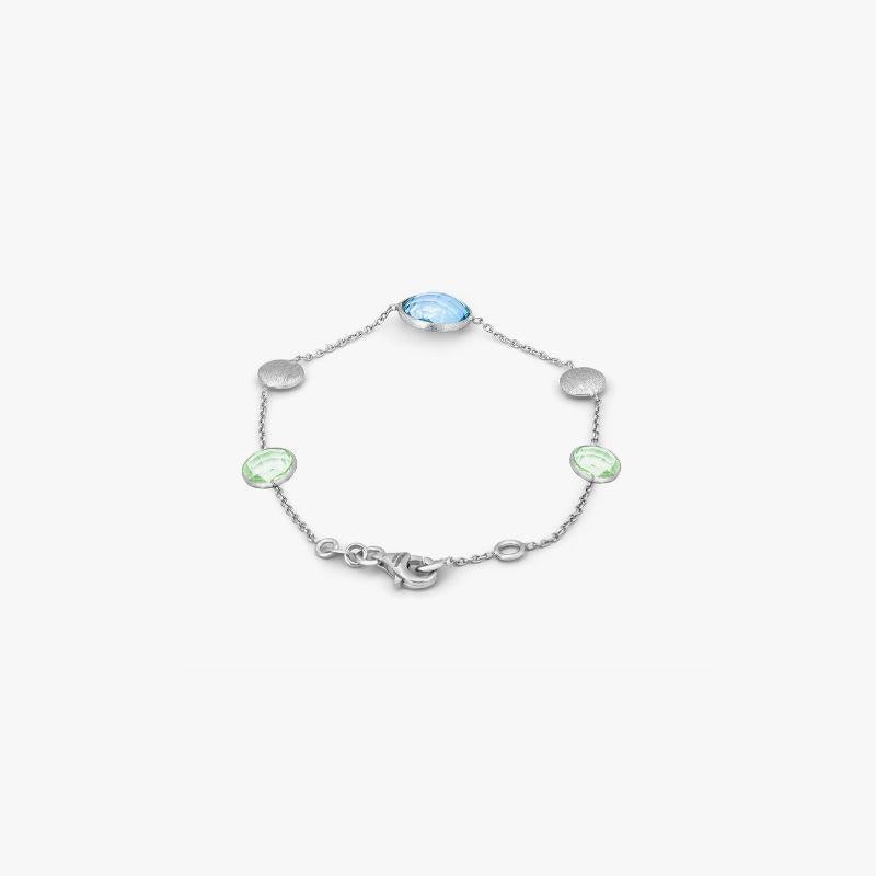9K satin white gold Kensington bracelet with topaz and green amethyst

This ladies chain bracelet is made from 9K white gold with a series of blue topaz and green amethyst stones, finished with a lobster clasp and 1cm extension. As the latest