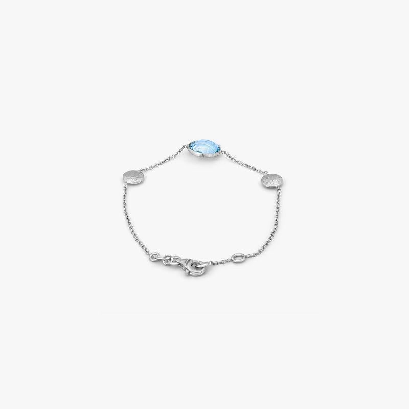9K satin white gold Kensington bracelet with topaz

A delicate chain bracelet made from 9K white gold and set with a solitaire blue topaz stone; finished with a lobster clasp and 1cm extension. As the latest addition to our Kensington Collection,