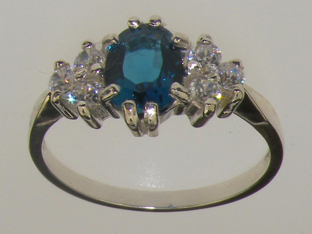 For Sale:  9k White Gold Oval Natural London Blue Topaz with Diamond Cluster Ring 2