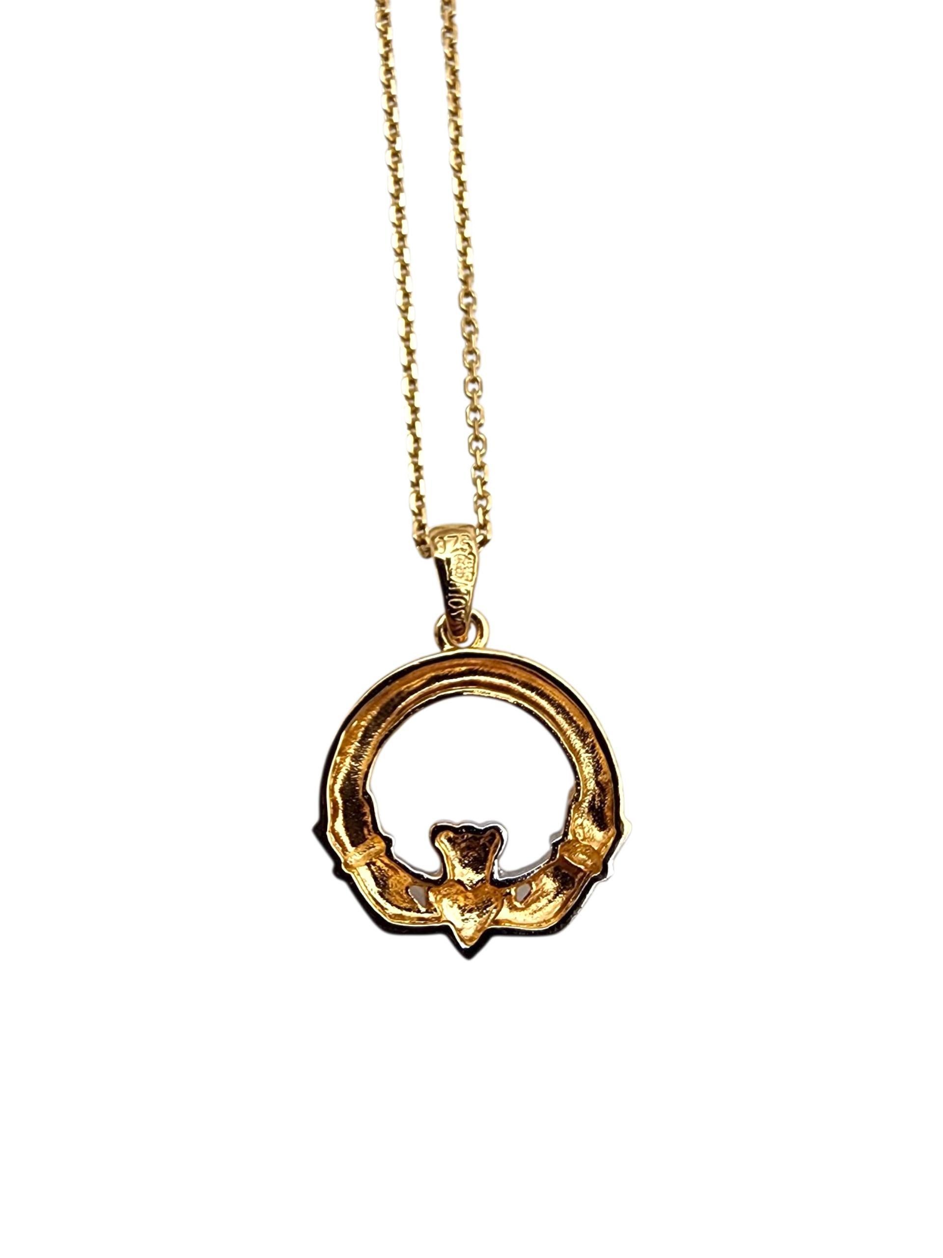 9K Yellow and White Gold Claddagh Pendant Necklace

This Claddagh pendant and chain, crafted in lustrous gold, features the iconic Irish symbol of love, loyalty, and friendship. With a crowned heart held by two hands, it's a timeless piece rich in