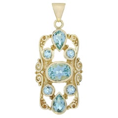 Pendentif de style victorien en or jaune 9K avec topaze bleue