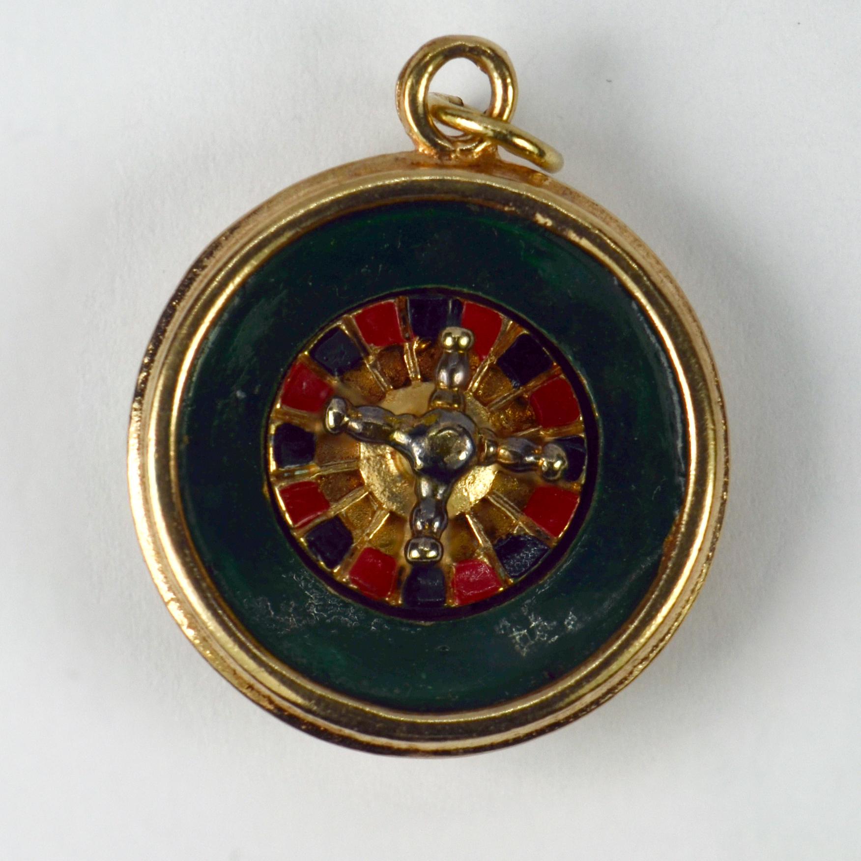 A 9 karat (9K) yellow gold charm pendant designed as a roulette wheel with spinning centrepiece and enamel wheel. Hallmarked for 9 karat gold, London, 1965 with makers marks IJL.

Dimensions: 2.5 x 2.1 x 0.8 cm (not including jump ring)
Weight: 7.92
