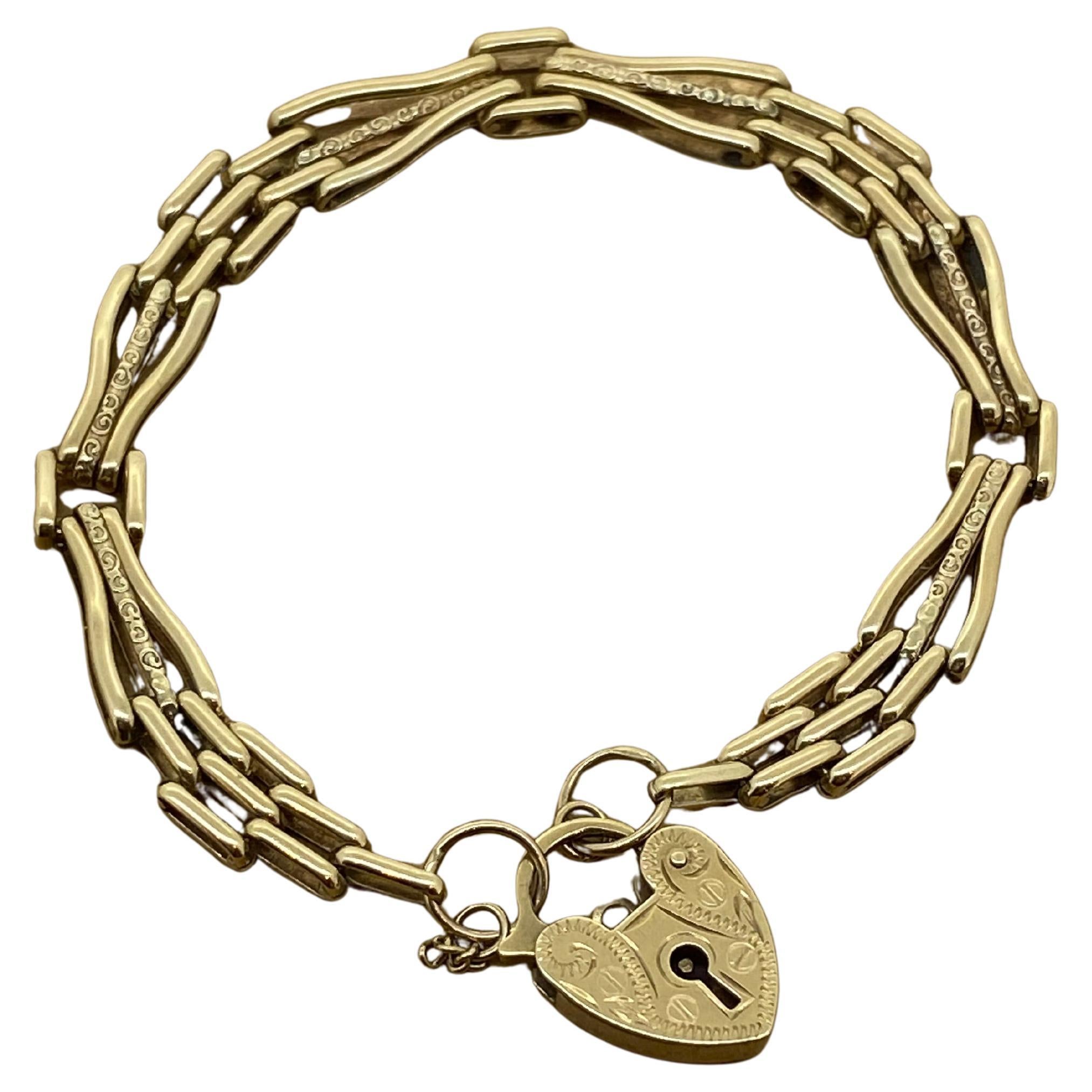 Bracelet en or jaune 9K avec cadenas finement gravé et maillons allongés Retro 1950's