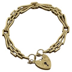 Bracelet en or jaune 9K avec cadenas finement gravé et maillons allongés Retro 1950's