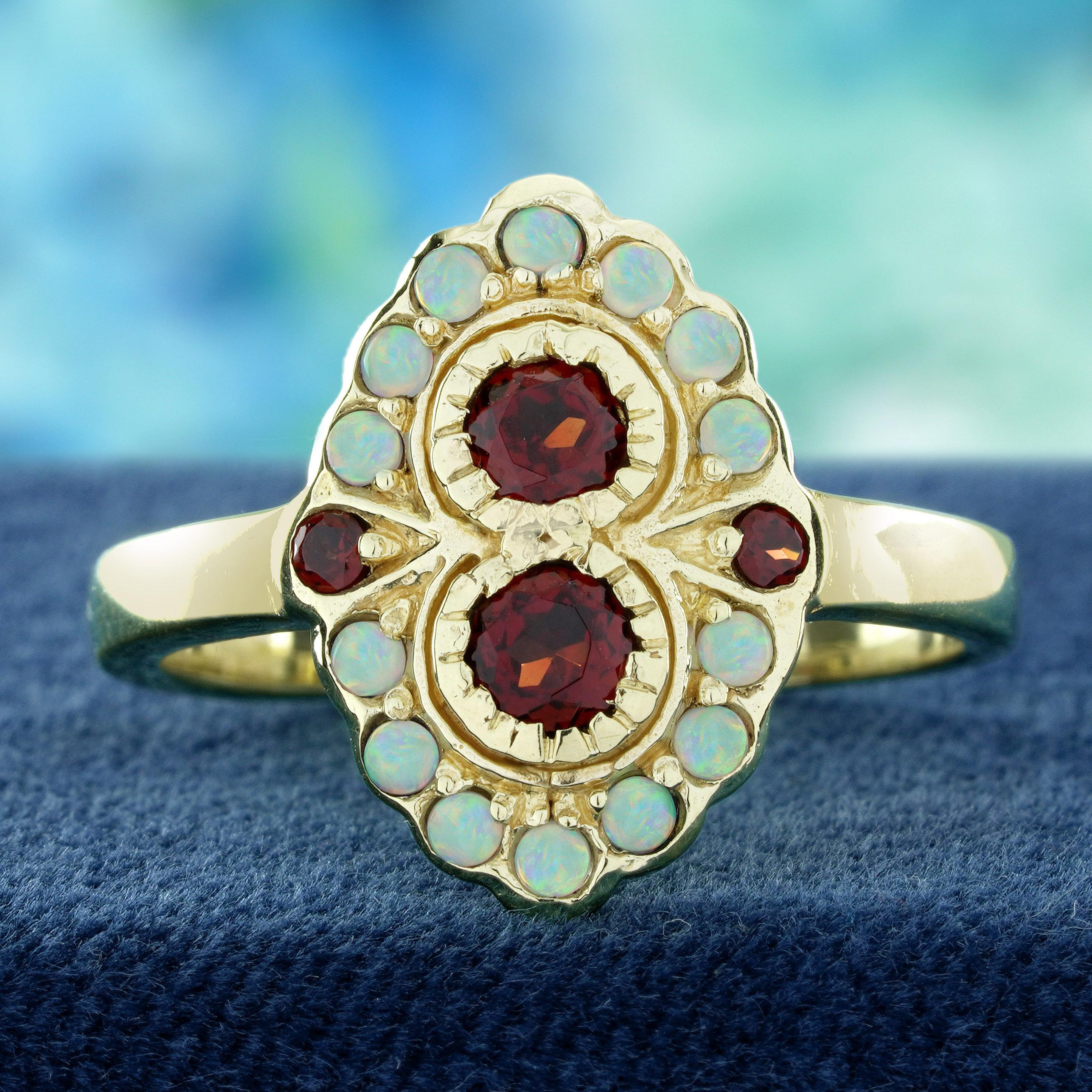Cette bague de style vintage met en valeur deux grenats naturels ronds sertis côte à côte, encadrés de délicats détails de milgrain pour une touche antique raffinée. Les grenats sont entourés d'opales rondes, créant un doux halo de couleurs irisées.