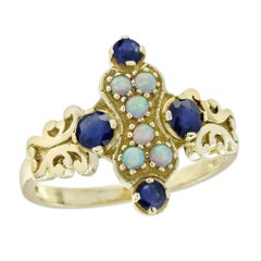 Anillo en racimo estilo vintage de ópalo natural y zafiro azul en oro amarillo de 9 quilates