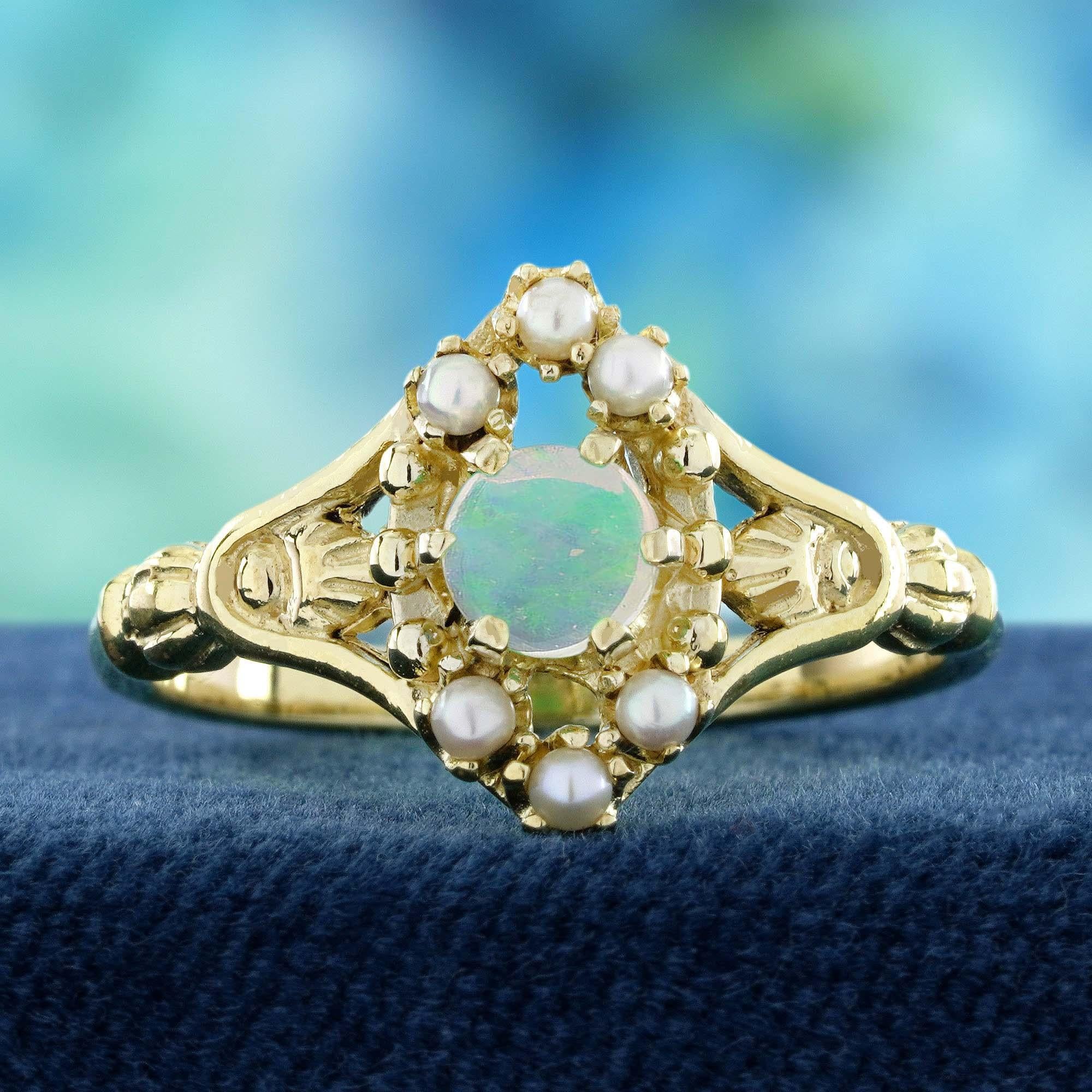 This vintage-style floral ring features a luminous round natural opal at its center, radiating a captivating play of colors. The opal is delicately encircled by lustrous pearls, enhancing its soft, elegant glow. The shoulders showcase intricate