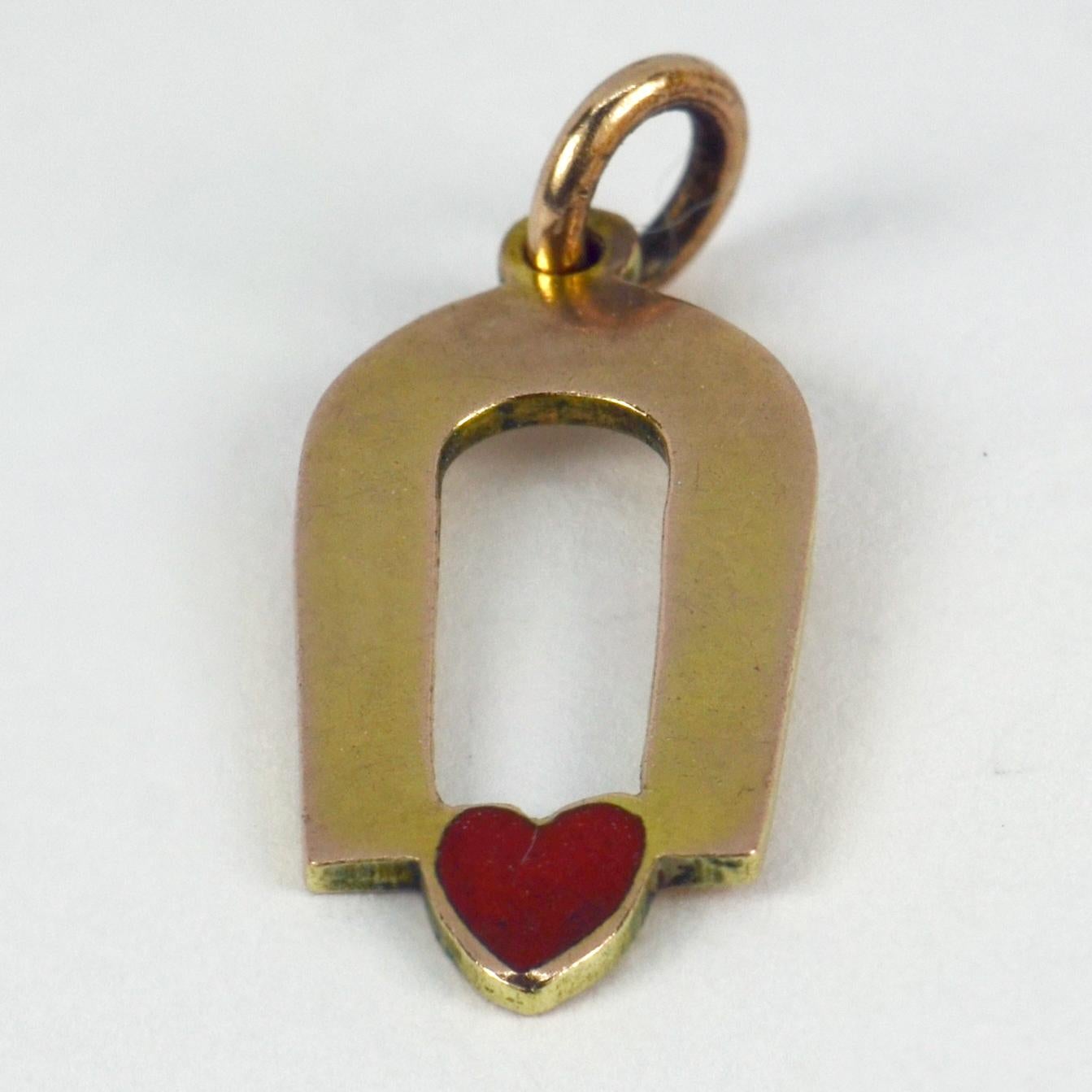 A 9 karat (9K) yellow gold charm pendant designed as a magnet attracted to a red enamel love heart. Stamped 9ct for 9 karat gold. 

Dimensions: 1.8 x 0.9 x 0.1 cm (not including jump ring)
Weight: 0.84 grams
