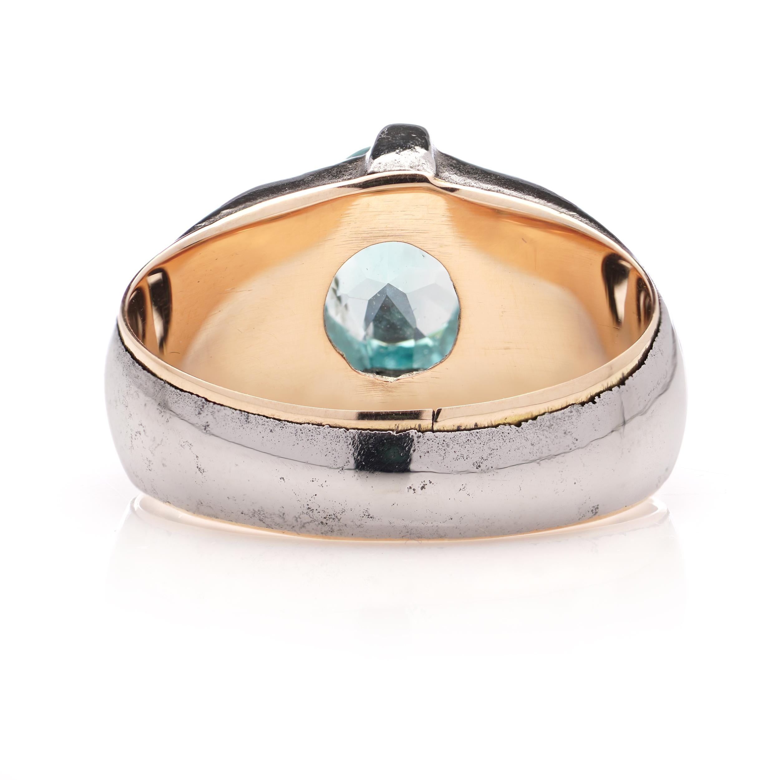 Women's 9kt pink gold and iron ring set with oval faceted 1.40 ct. blue topaz. For Sale