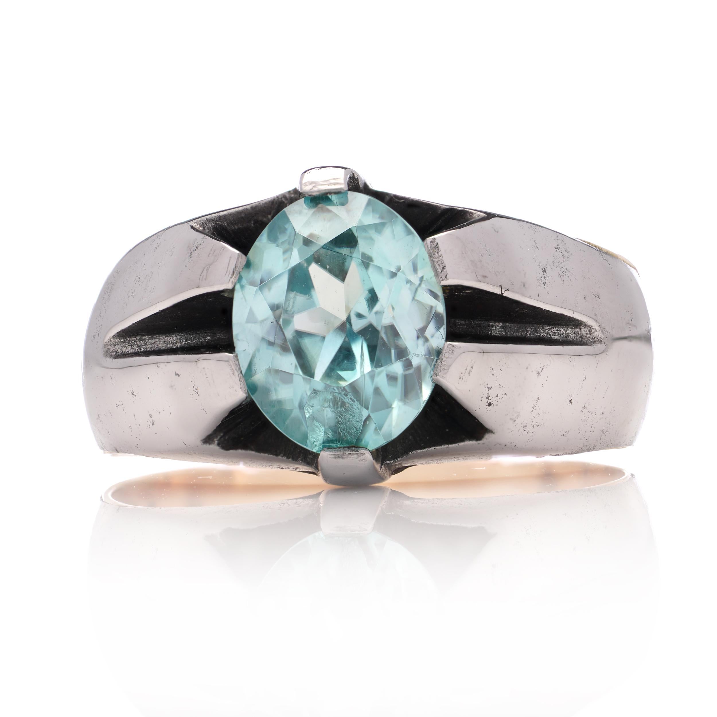 9kt pink gold and iron ring set with oval faceted 1.40 ct. blue topaz. For Sale 2