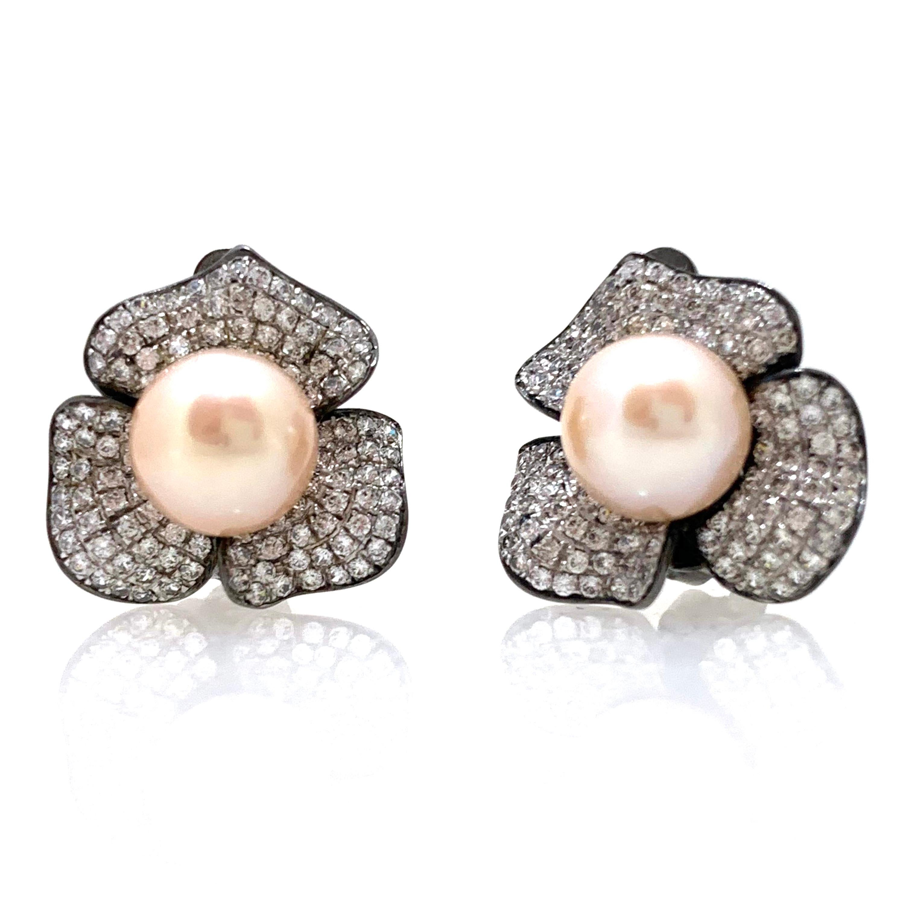 Stunning 9mm Akoya Pearl and Pave Simulated Diamond Flower Sterling Silver Earrings. 

This estate-style earrings features two 9mm perfectly round natural pink-peach color Japanese Akoya pearls on the center. The petals contain 226 round brilliant