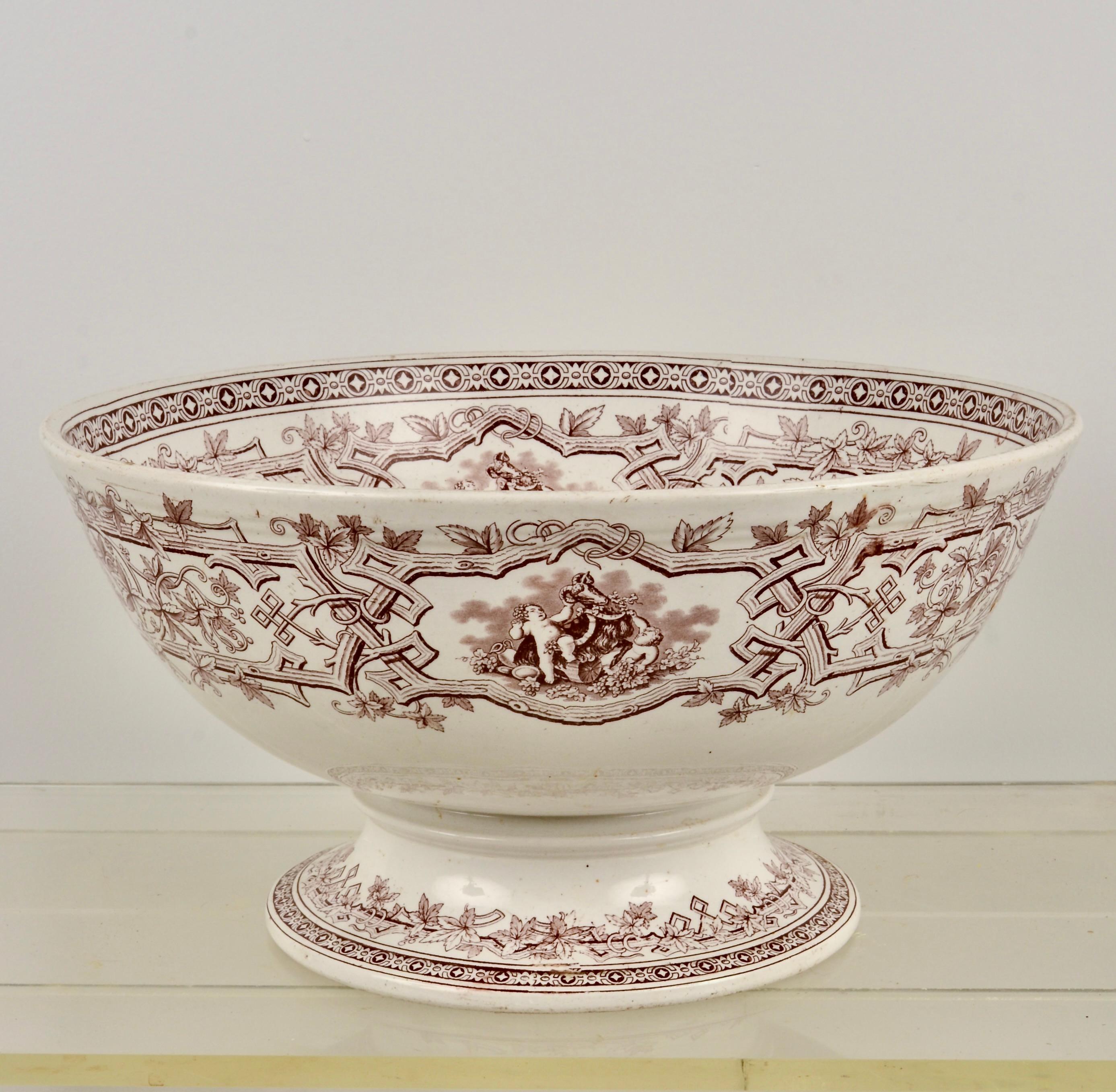 Wonderful large scale on this English bowl.  Transferware design featuring the natural motifs, popular in the arts and crafts movement surround more traditional romantic genre scenes. Very fine vintage condition. No damage. 