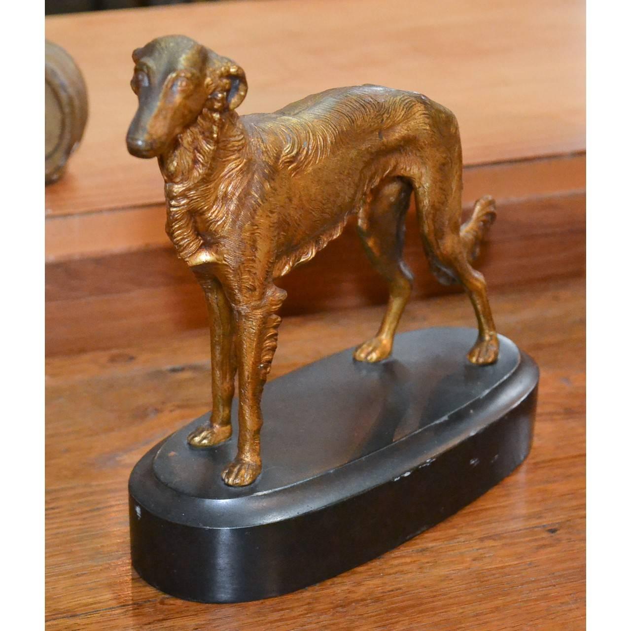 Impossible to resist this little Borzoi dog! Made of gilt brass on heavy custom lead base in England, circa 1880.
Total height 8 inches x 9 inches wide. Would make a happy desk accessory or add warmth to a bookcase.