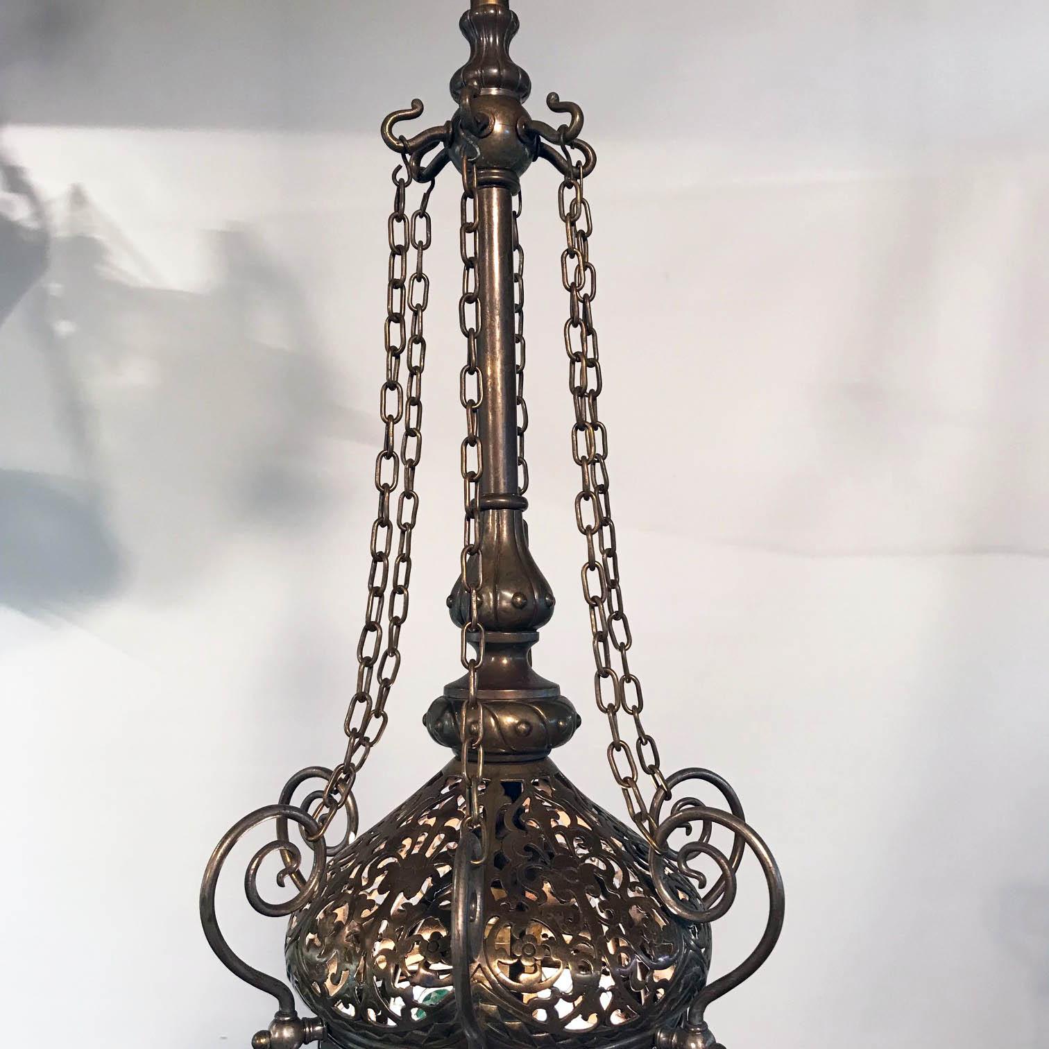 This fixture is very much in the Moorish taste, orientalism, a romantic view of the Levant, was expressed in paintings furniture and in this case lighting. Often such a lamp was used in a library / smoking room or in a hall. The minaret-shaped cover