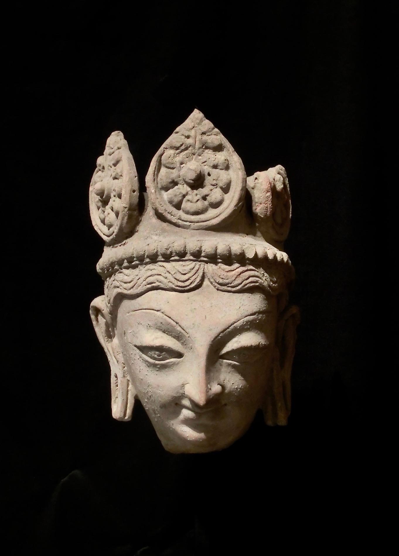 This piece is an incredibly rare terracotta head of a male deity. This piece is from the Mardan-Hund region, Pakistan, circa 9th century.

The pieces dimensions are 15 x 16.5 x 24.5 and this piece comes with a high quality Stand.

Please contact