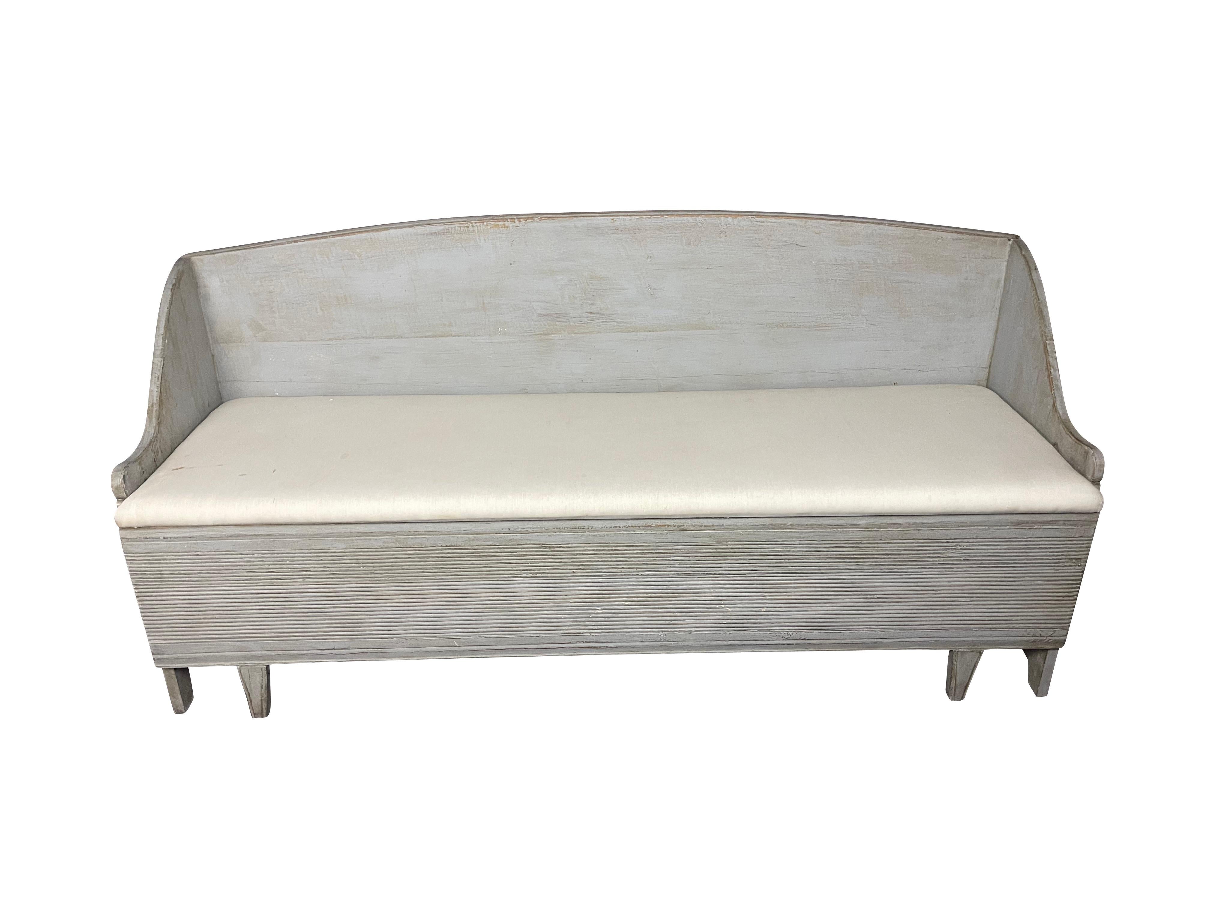 A charming grey-painted Swedish Gustavian hall bench or sofa would make a lovely kitchen settee or hall / mudroom bench and provide excellent storage. Simple, clean lines with a round back, classic reeded front, and a muslin cushion that can be
