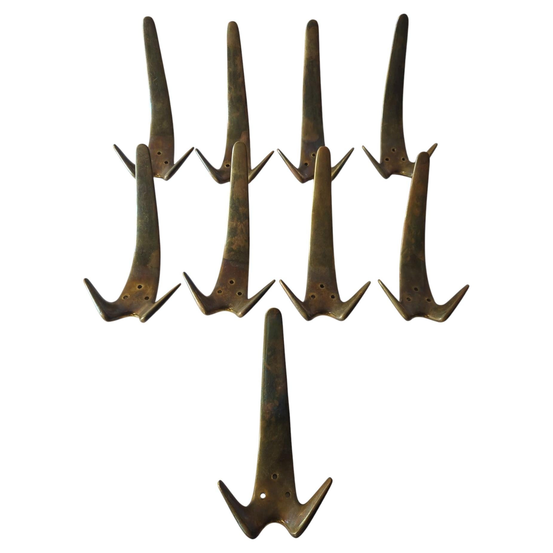9x Carl Auböck Model #4056 Brass wall hooks 1950s For Sale