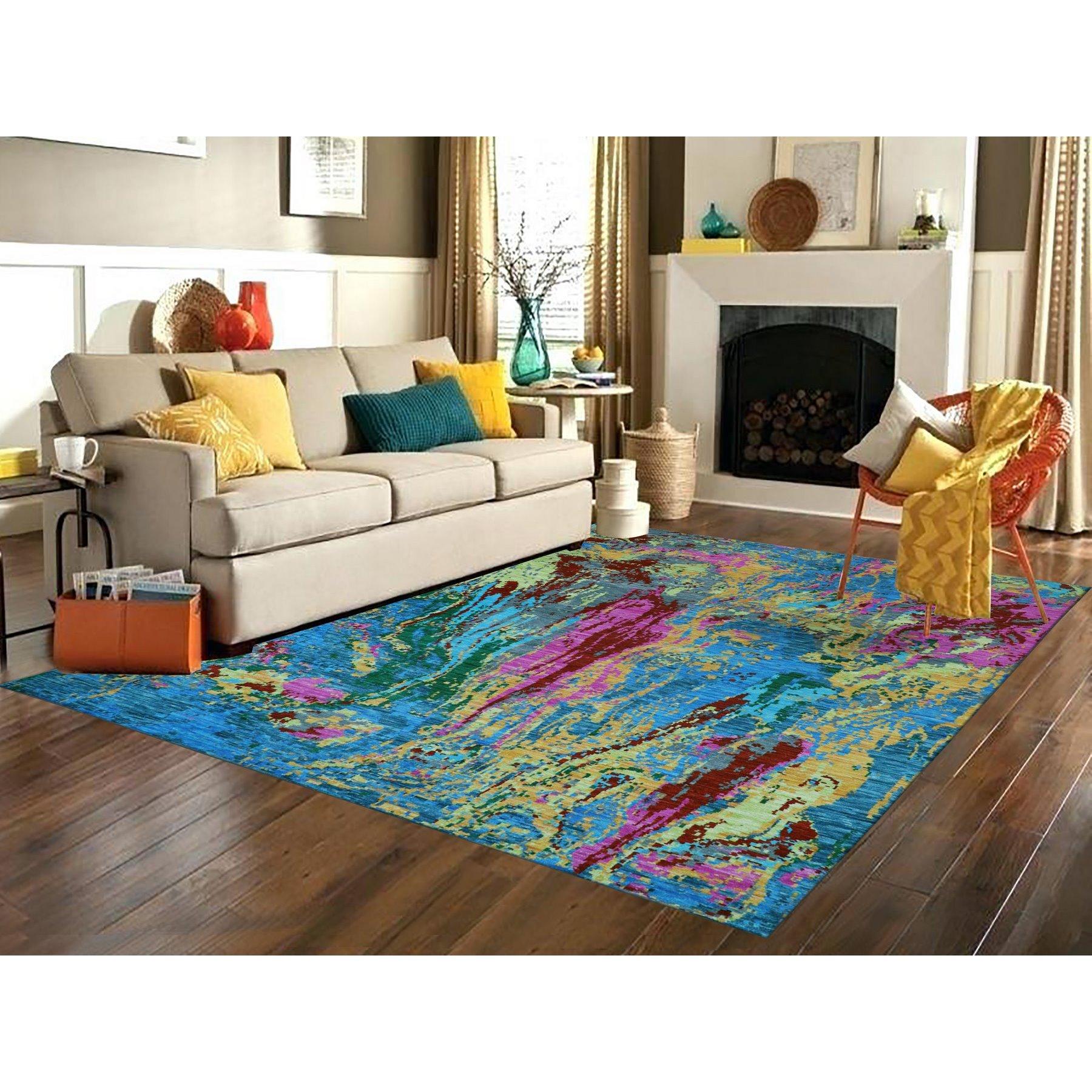 Hot Pink with Sapphire Blue, Modern Design, Hand Knotted, Soft to the Touch, Pure Wool, Oriental Rug
Primary materials: Wool
Latex: No Pile 
height: 0.25 Inches
Style: Contemporary
Primary color: Blue
Secondary colors: Yellow, Orange, Green, Red,