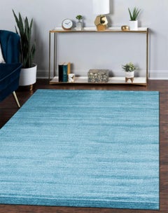 Alfombra de 9 x 12, azul, tejida a mano en lana y viscosa, con sutiles tonos del horizonte y un diseño de campo abierto
