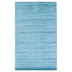 Alfombra de 9 x 12, azul, tejida a mano en lana y viscosa, con sutiles tonos del horizonte y un diseño de campo abierto