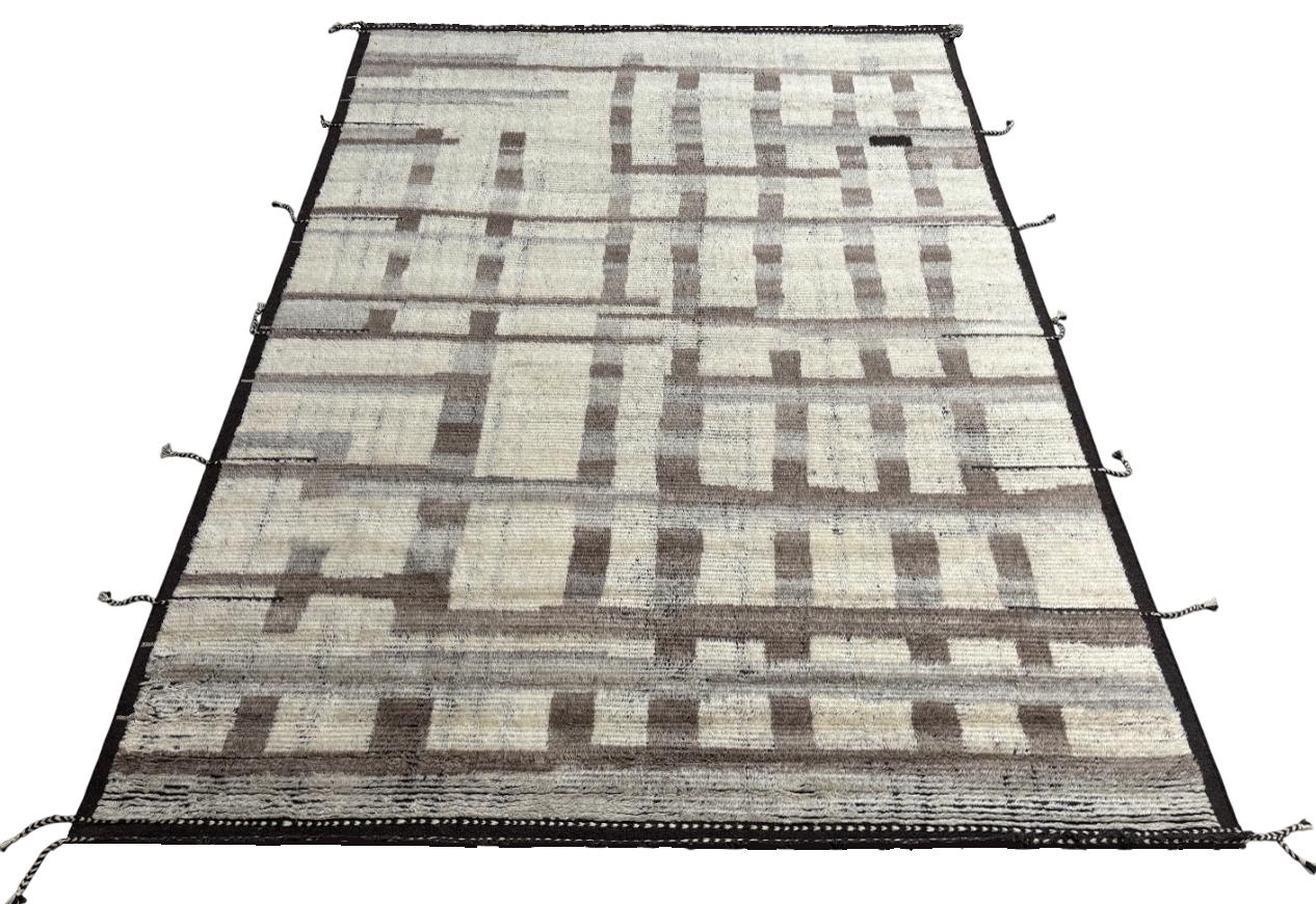 Elevate your living space with the exquisite charm of this new modern hand-knotted Moroccan berber beni ourain rug, crafted with precision and care from 100% wool. Combining the allure of Moroccan design with contemporary sensibilities, this rug is